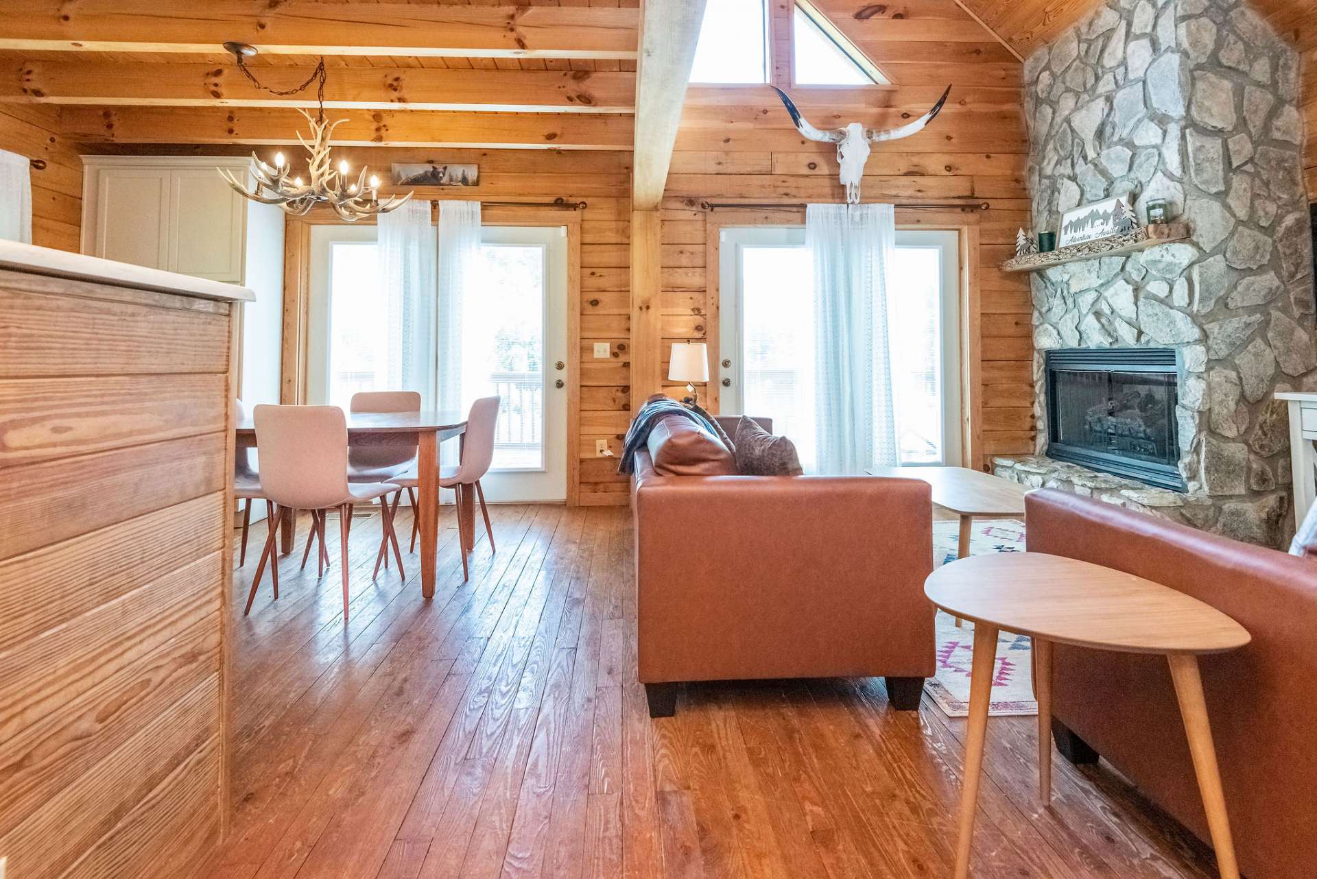 The open floor plan provides easy transition from the living area to the kitchen and dining areas.