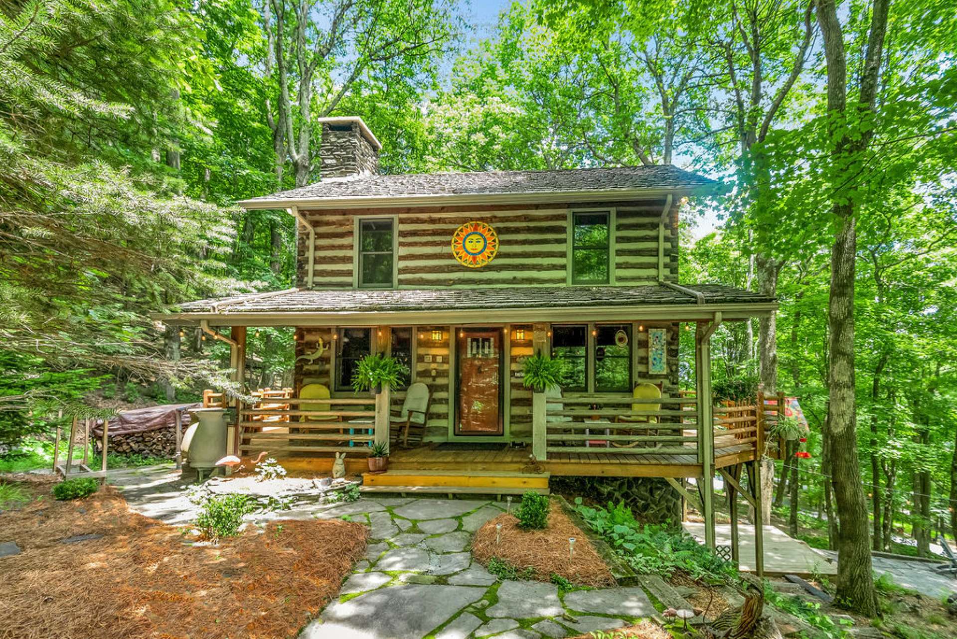 The flagstone walkway invites guests to a welcoming covered front porch.