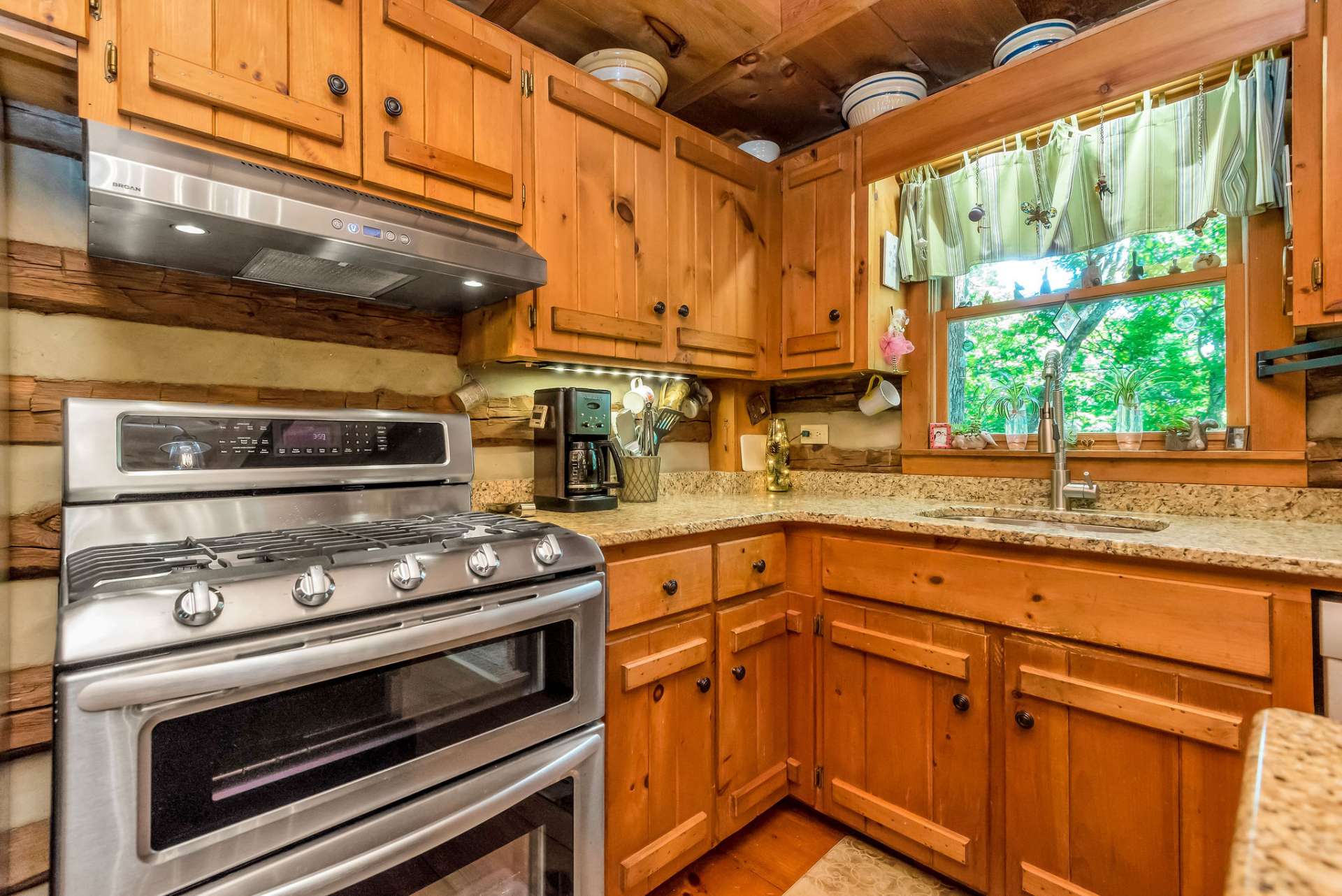 Featuring all of life's modern conveniences: stainless appliances including a convection gas range with double ovens, and granite counter tops.