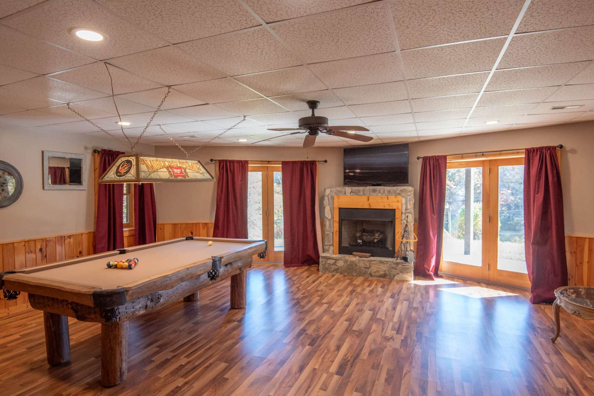 Lower level game room with gas log fireplace