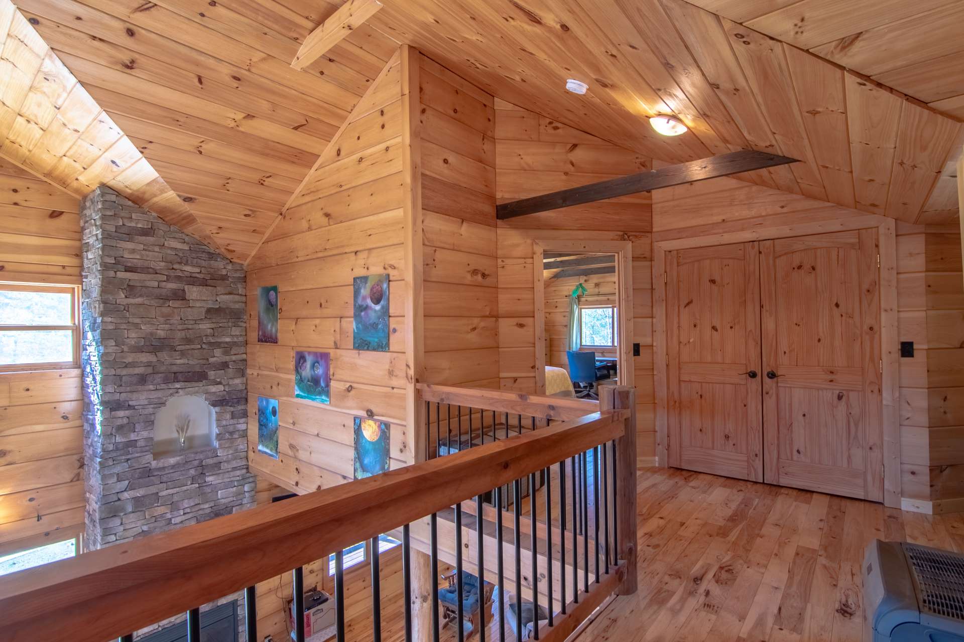 Here you can truly appreciate the architectural interests this log home offers.