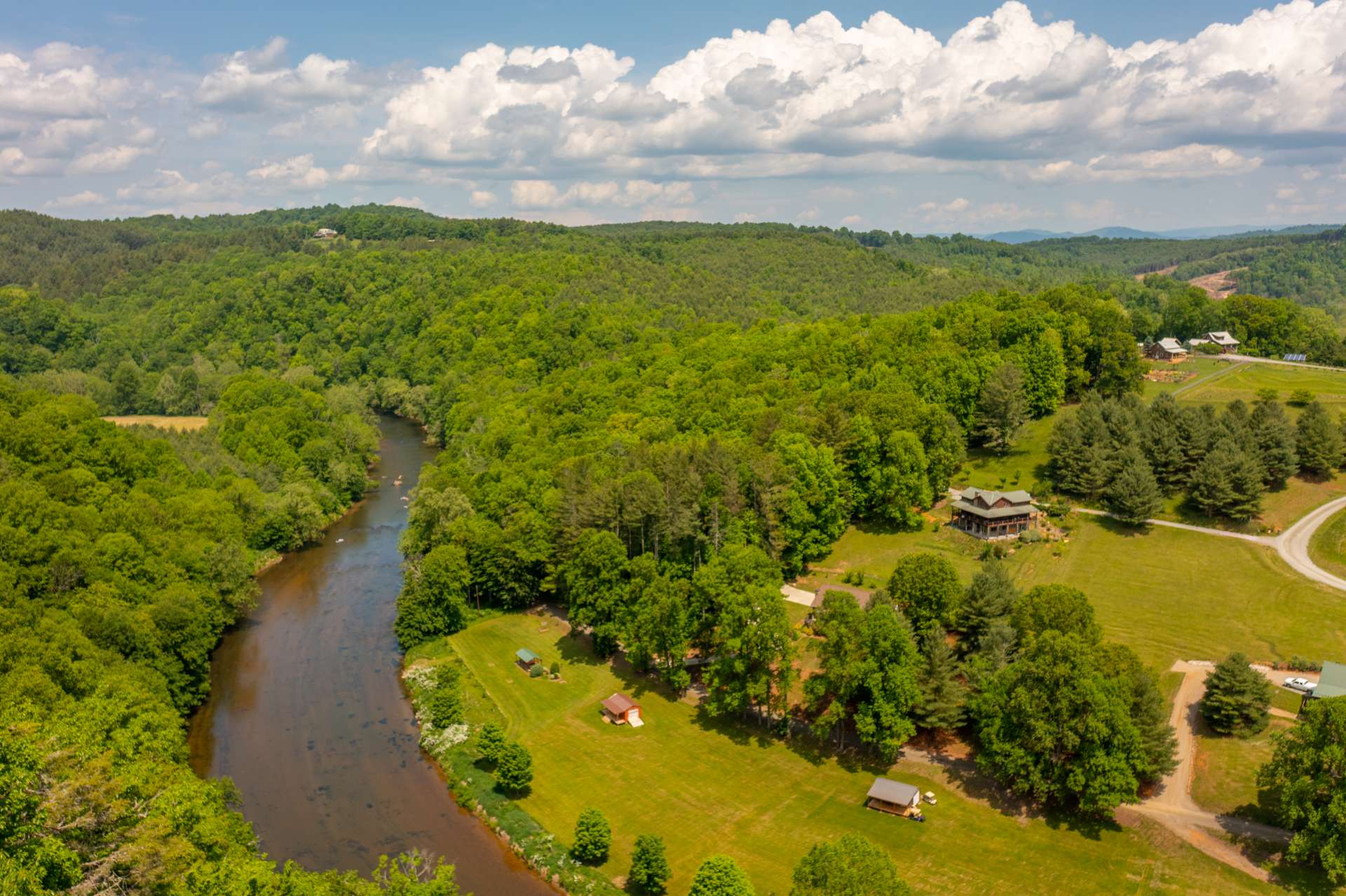 The surrounding mountains offer a changing back drop to the New River through each of the four seasons.