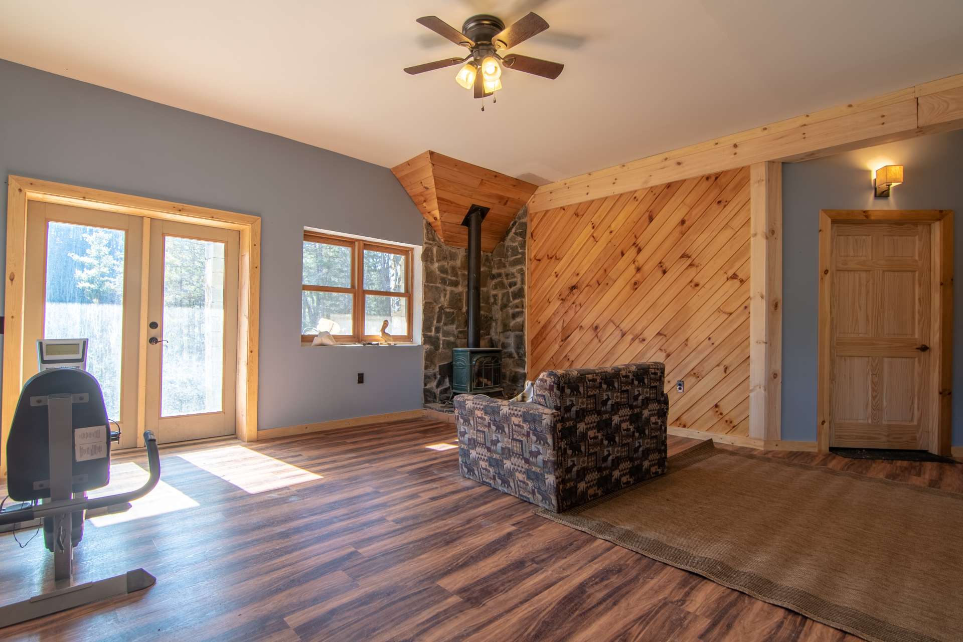 This area features a gas burning stove with stone surround.