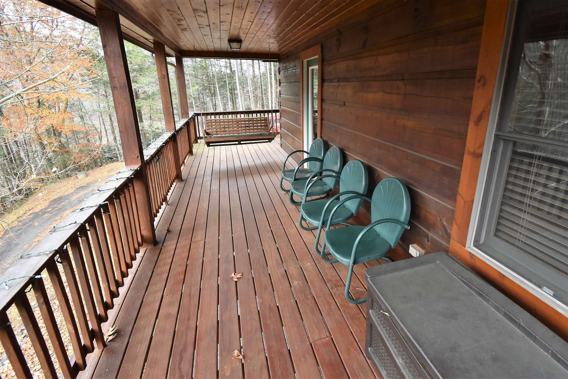 A full length covered back deck offers a place for relaxing with Nature or entertaining.