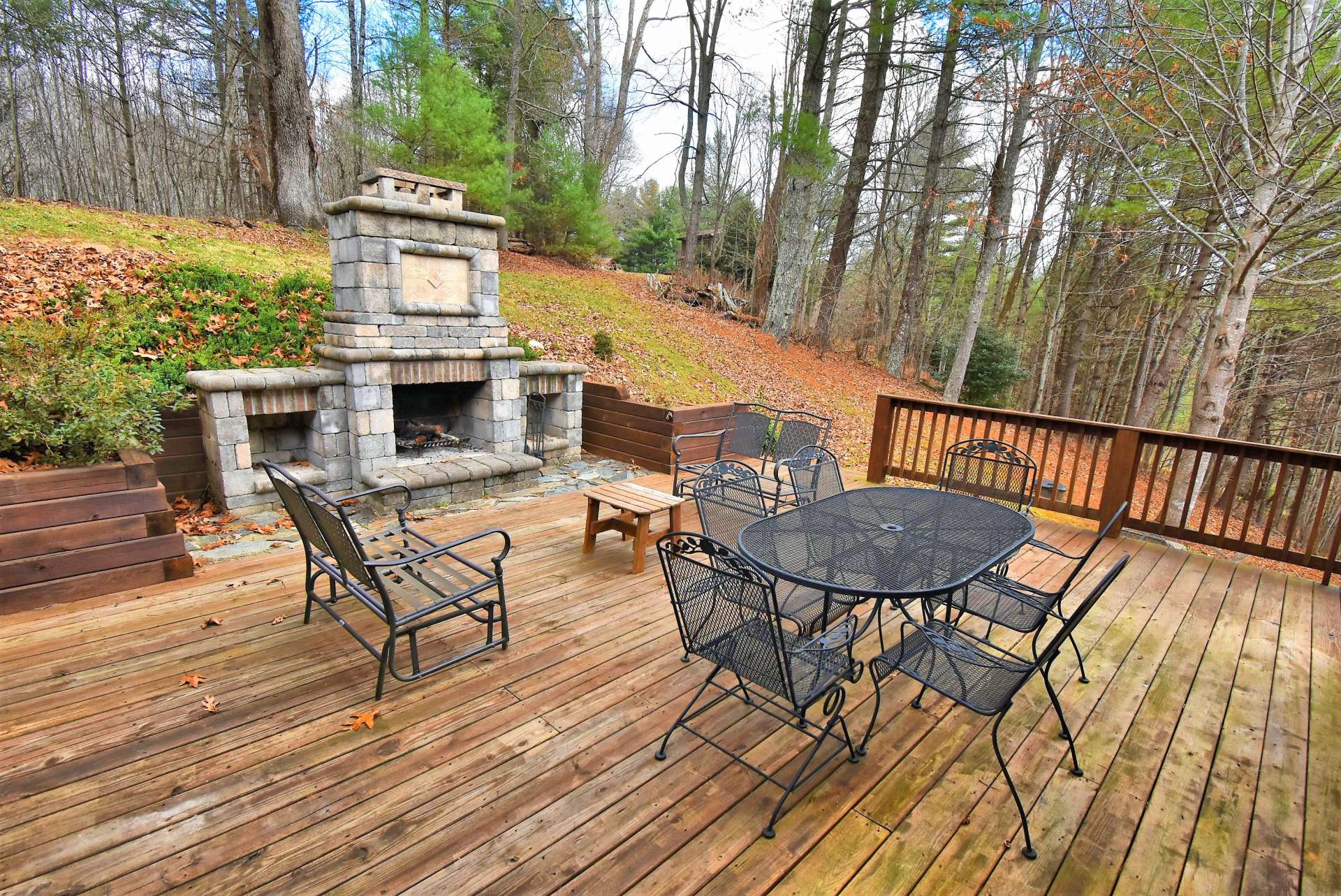 This wonderful open deck area with fireplace expands the outdoor living space.  You will love spending time with friends and family  sharing stories, making smores, and making memories.