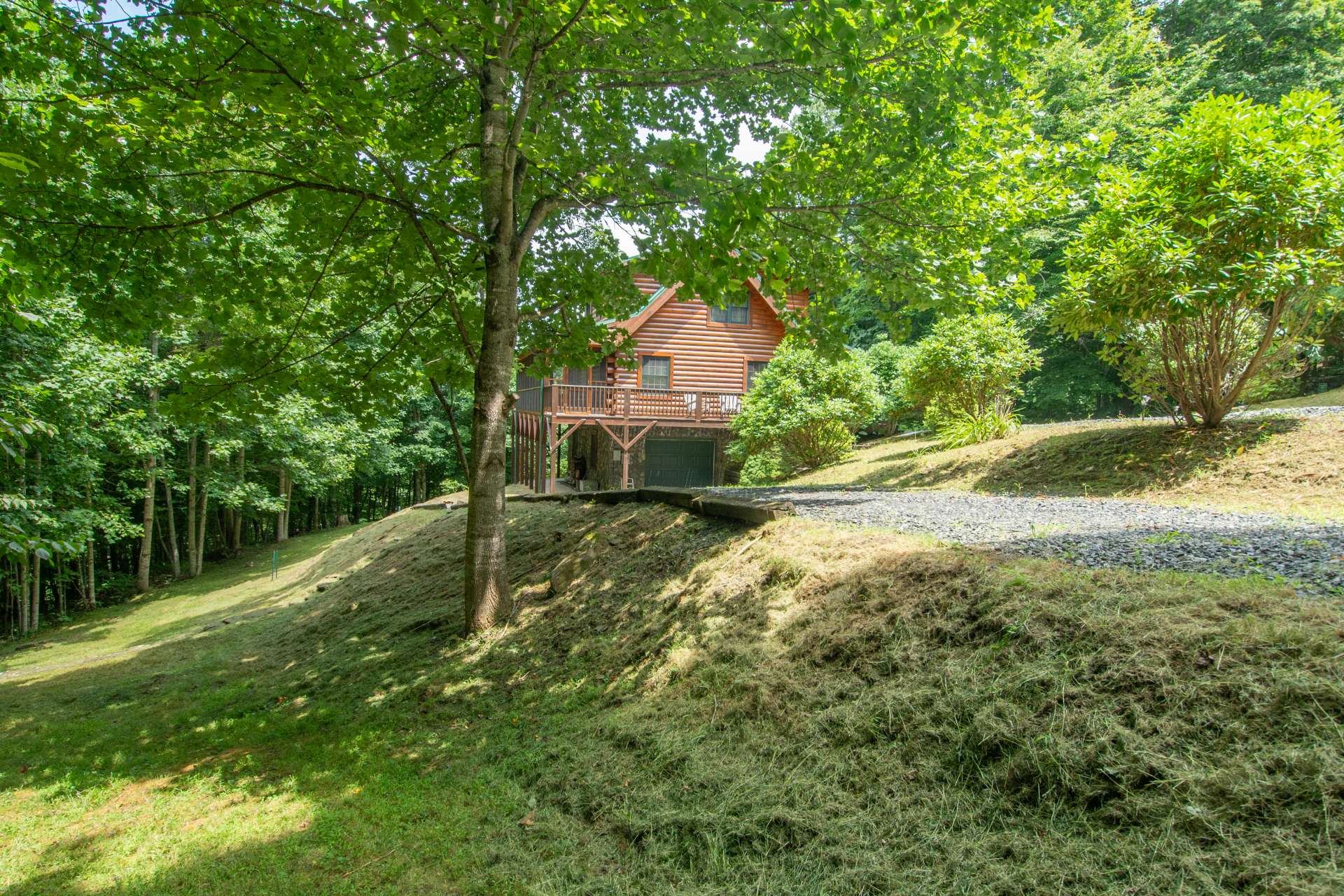 Multiple covered porches and extended decking offer abundant outdoor dining and entertaining space surrounded by Nature.