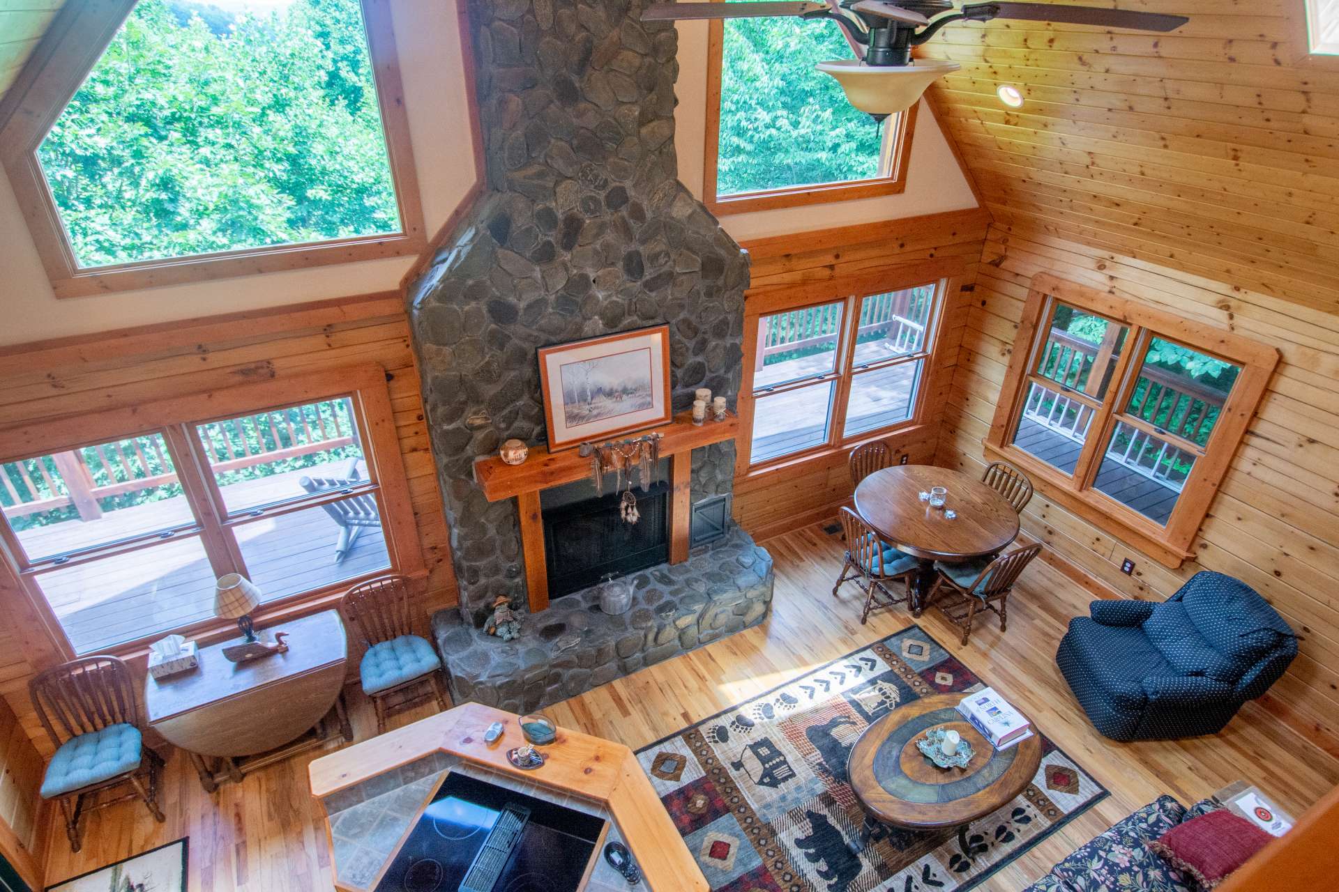 Cathedral ceilings and exposed beams add an extra sense of spaciousness throughout the home.