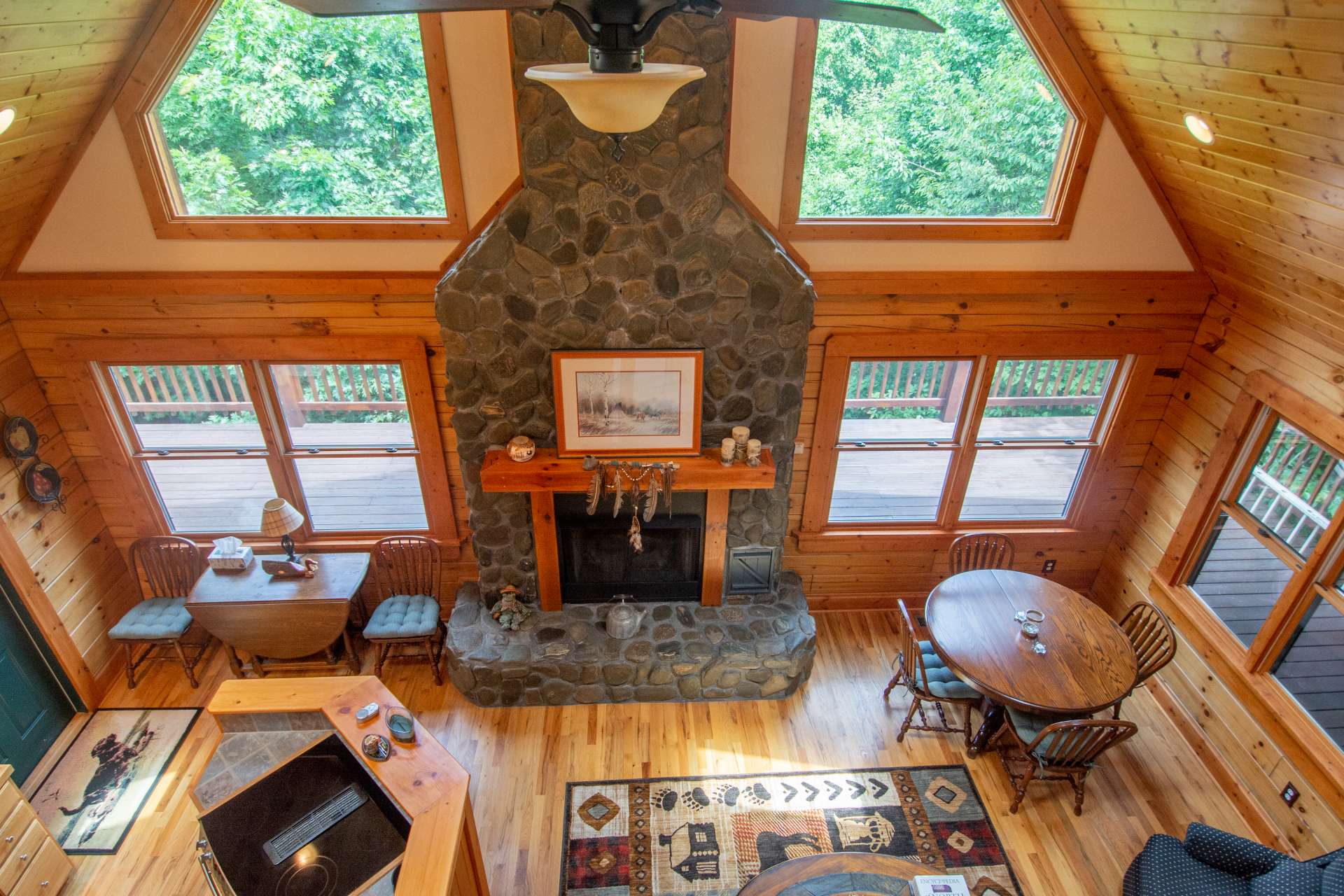 Dramatic Trapezoid windows and oversized double hung windows flood the room with light.