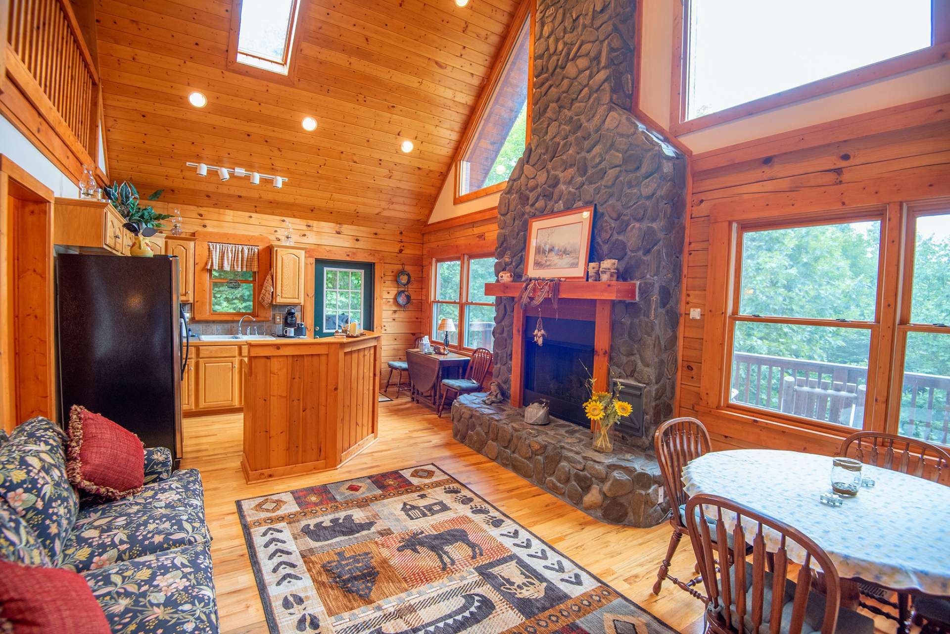 Cathedral ceilings and exposed beams add an extra sense of spaciousness throughout the home.