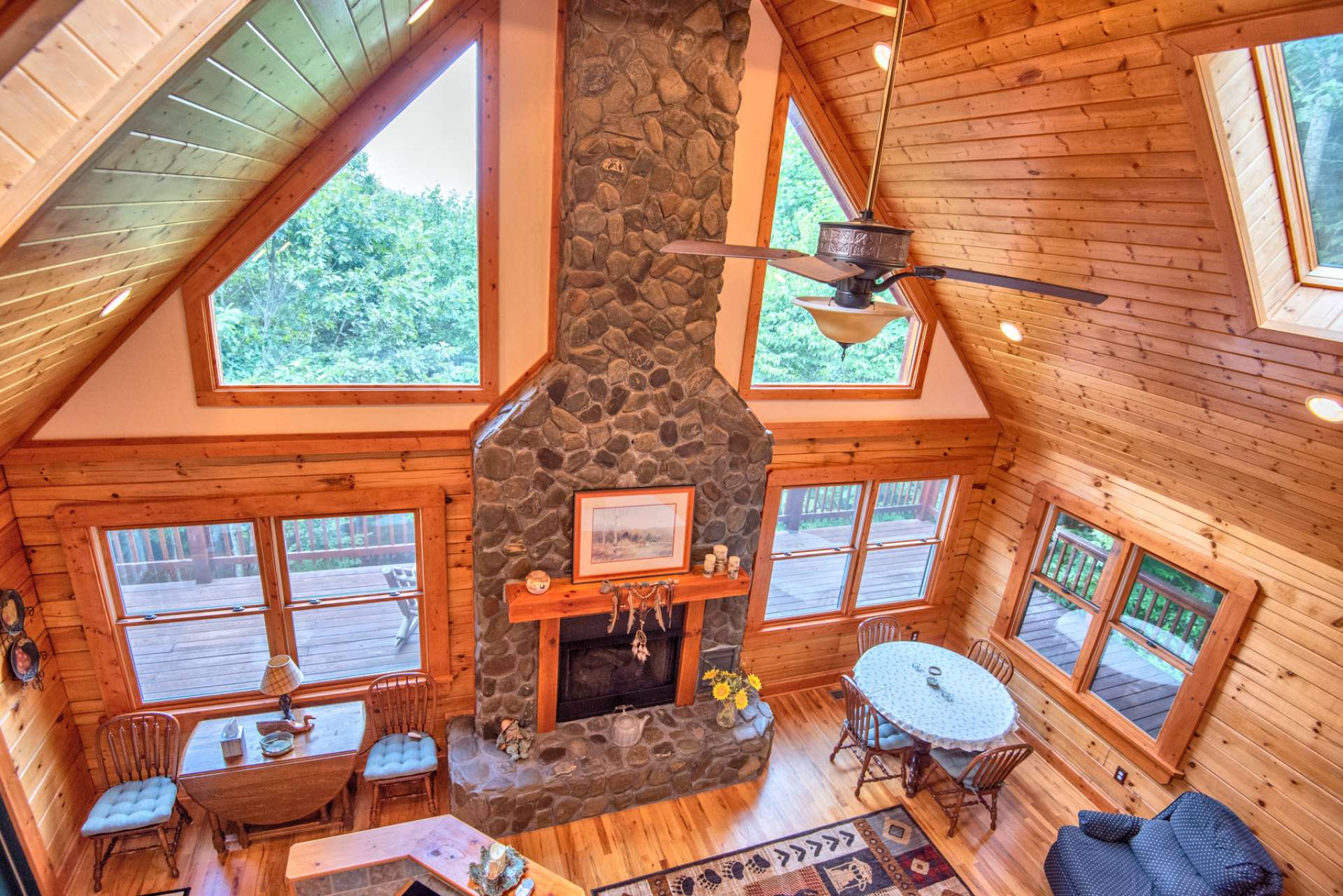 Dramatic Trapezoid windows and oversized double hung windows flood the room with light.