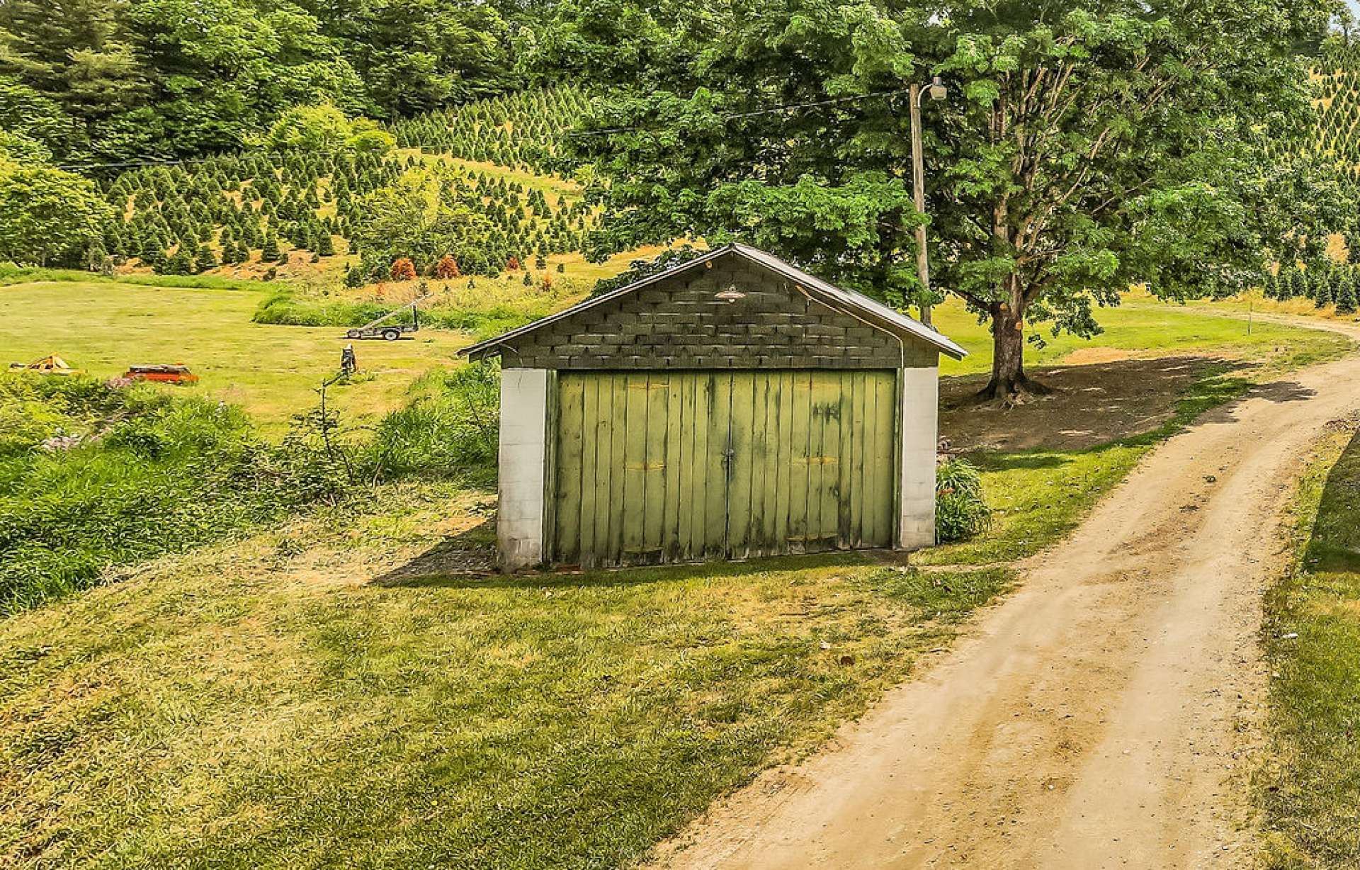 Outbuilding could be used as a one car garage, equipment storage, or a workshop.