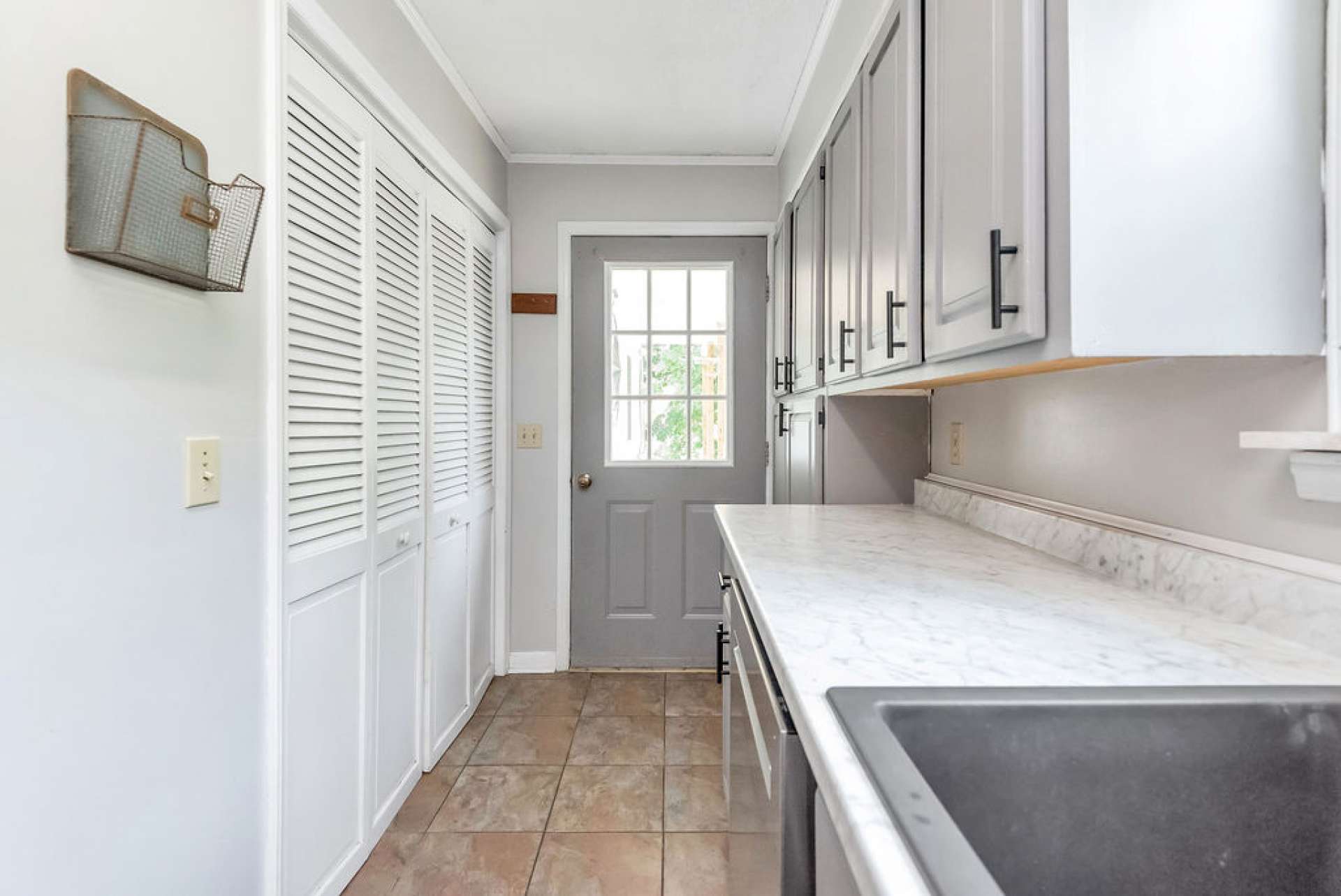 Laundry is off of the kitchen. The backdoor leads to the back porch and parking area.