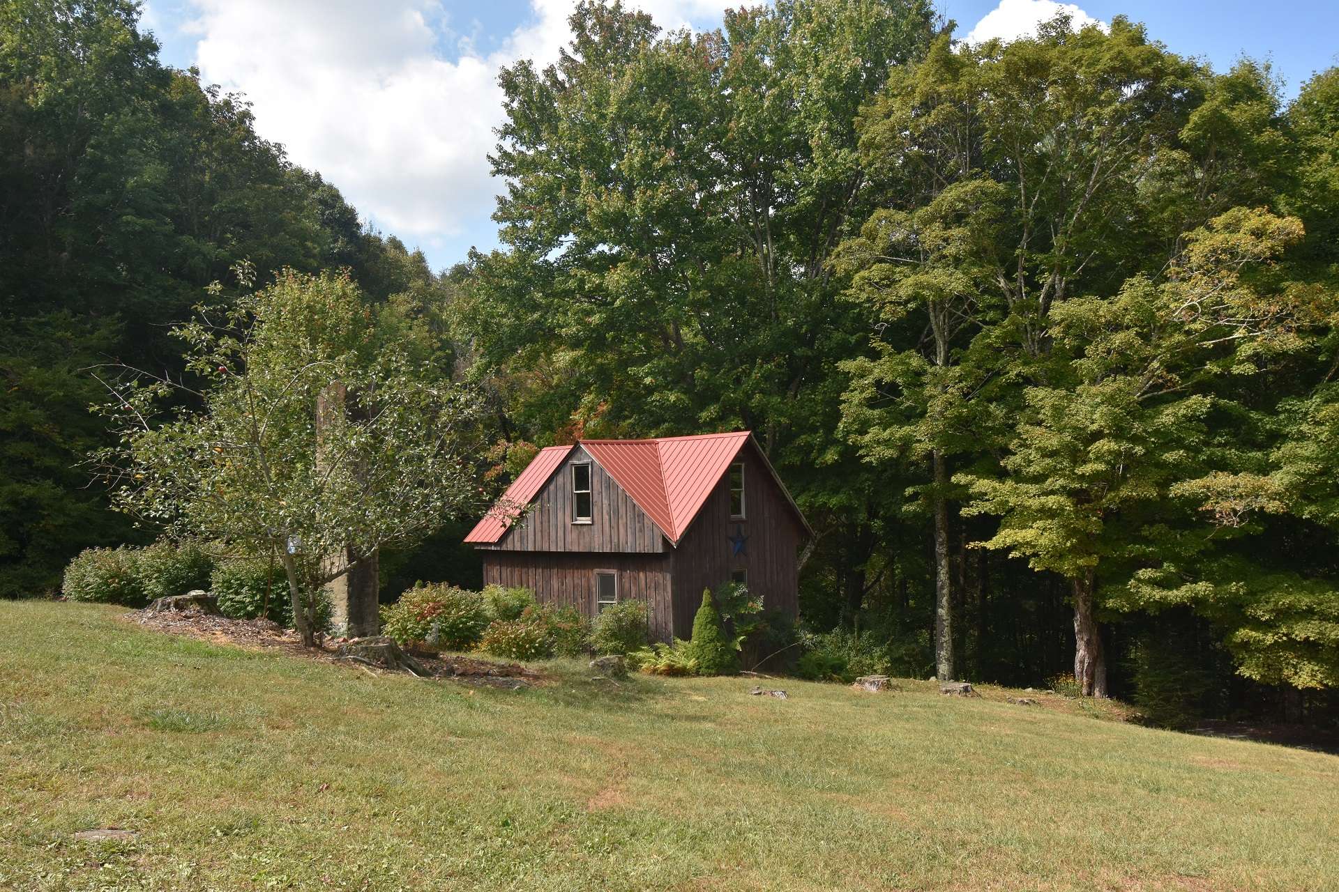 The property includes this awesome outbuilding that was once the old homeplace.
