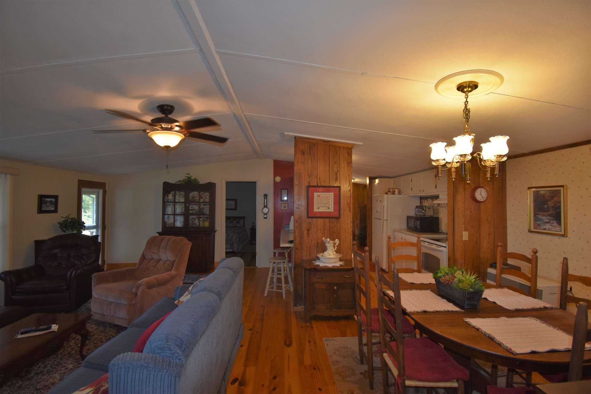 The center of the great room is the dining area. This open floor plan creates an easy transition from the living area to the kitchen and dining areas.