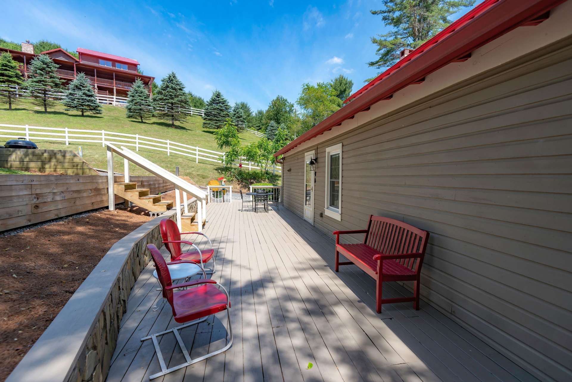 In addition to the front porch, an open back deck provides more outdoor entertaining space.