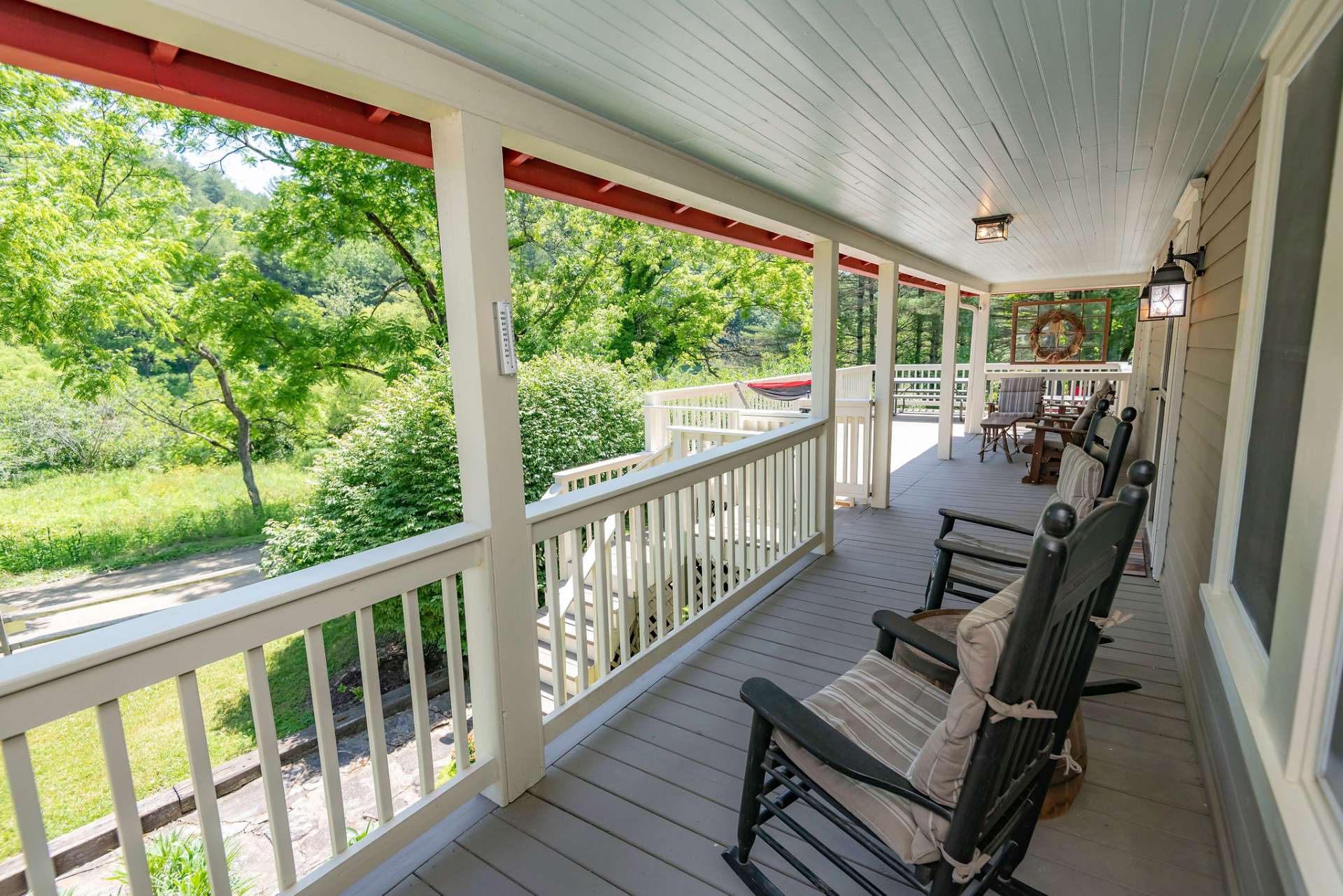 No farmhouse is complete without the rocking chair front porch... this one won't disappoint & includes a lovely view of the New River just across the road.