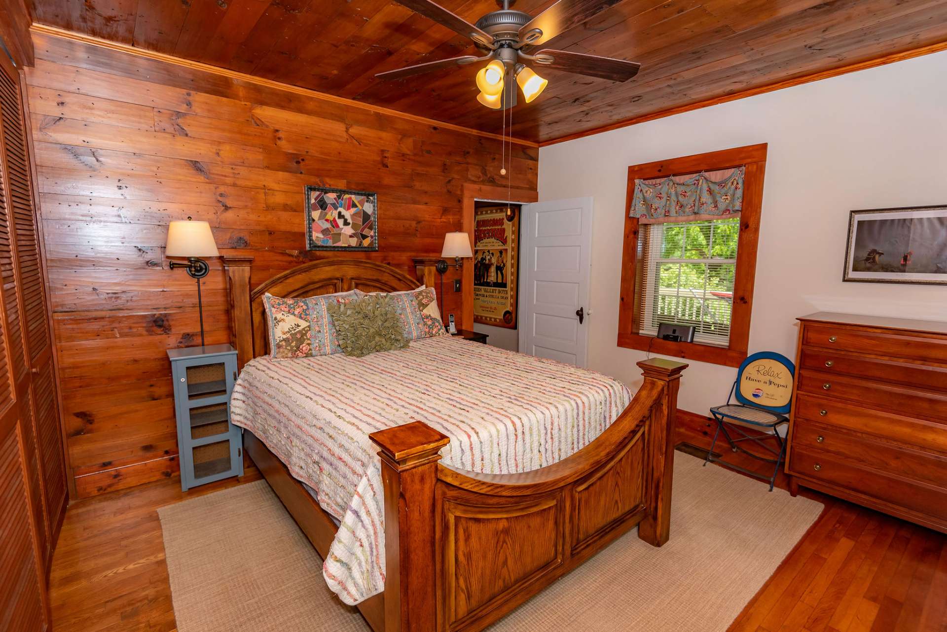 The main level master bedroom offers more original woodwork and a private bath.