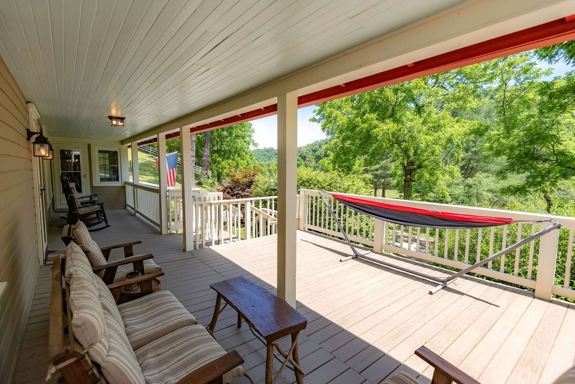The partially covered front porch offers a relaxing space to enjoy a lazy summer afternoon, or outdoor entertaining.