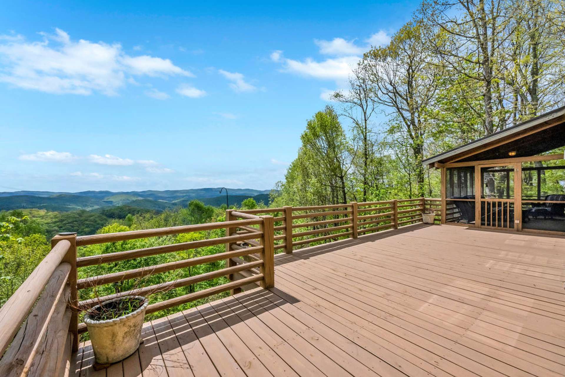 The great room opens up to a spacious deck designed for entertaining, sunning, or relaxing evenings under the stars.