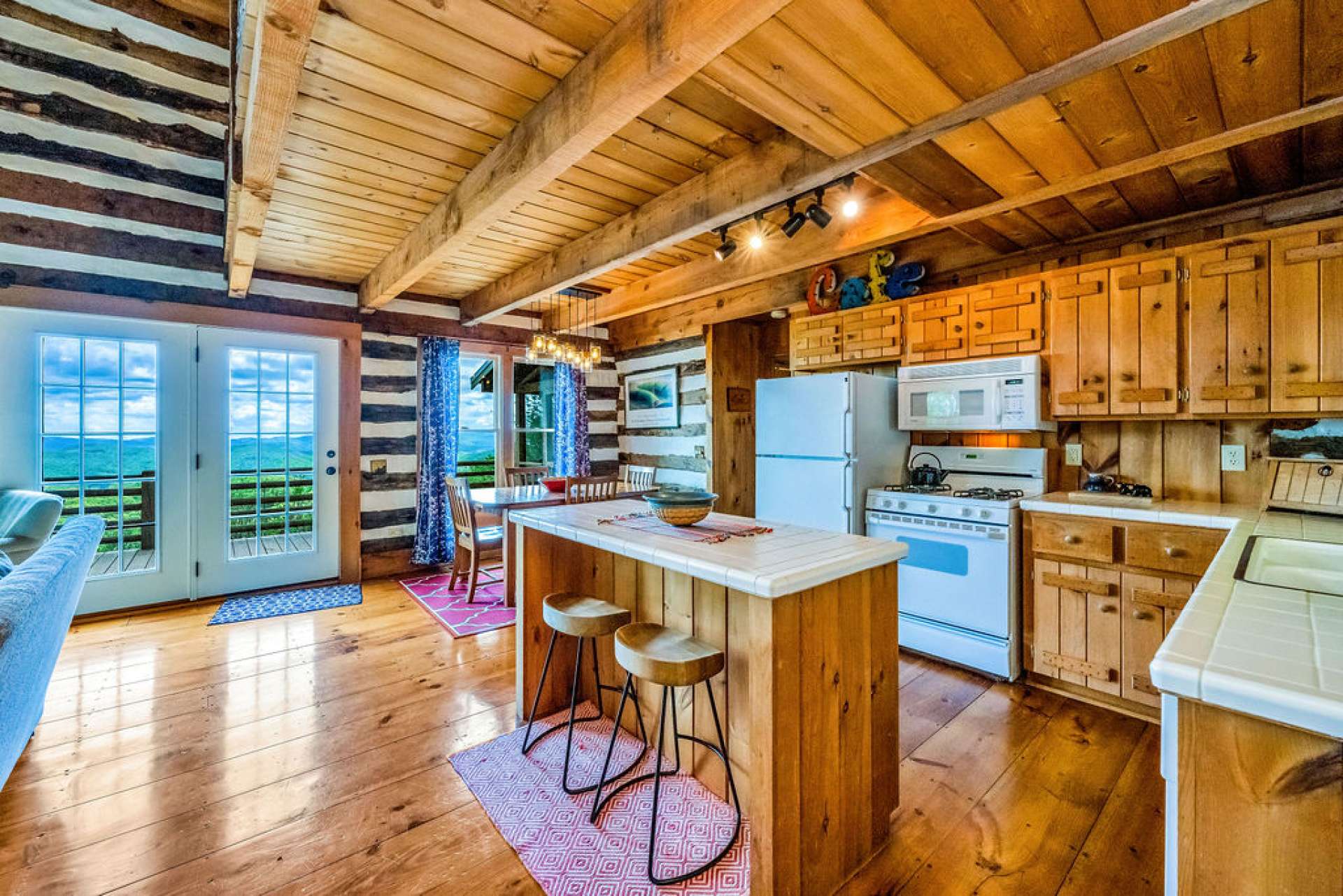 This great room features a backdrop that will change and amaze all the days of your mountain life.