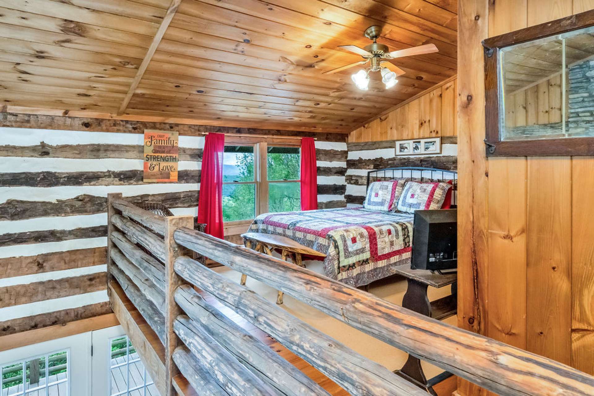 Your guests will love the elevated tree-top experience this loft bedroom creates.