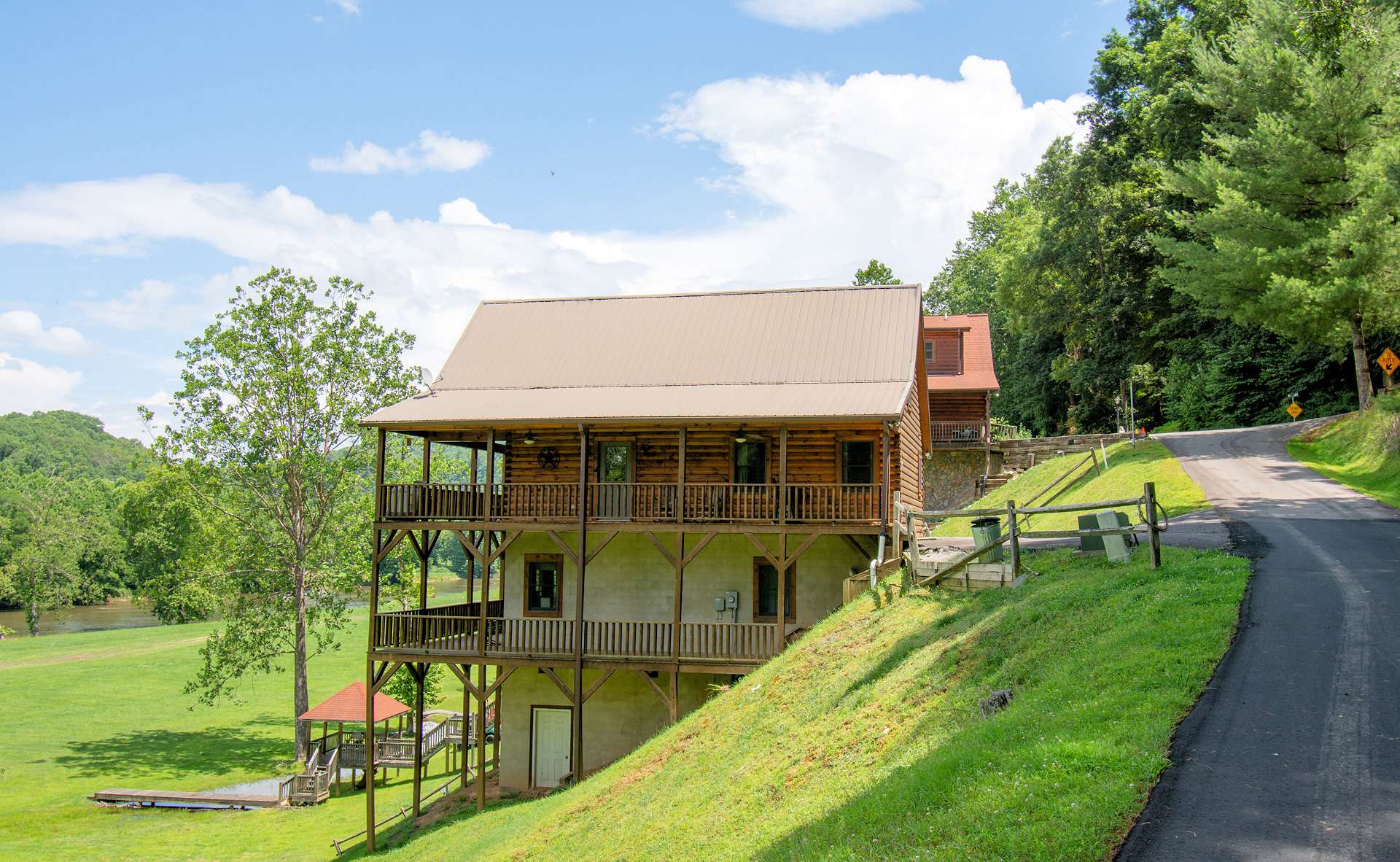 This 3-bedroom, 3-bath log cabin offers a wonderful mountain and river retreat for those seeking to get away for fresh mountain air and water recreation.