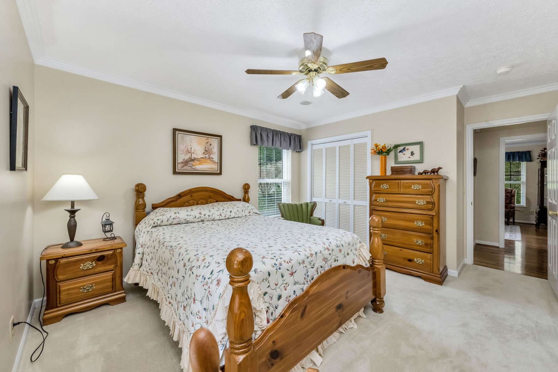 The main-level guest bedroom provides ample space for guests to relax and unwind in comfort.