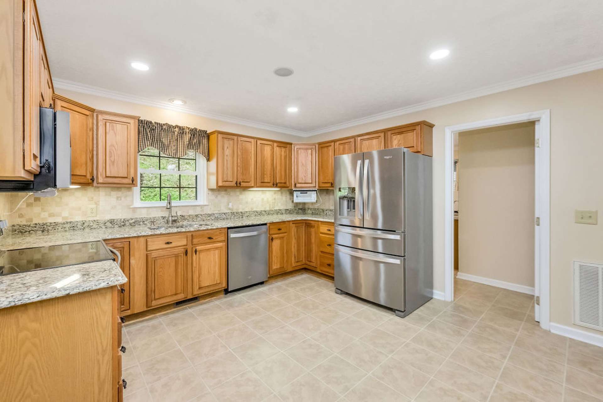 Enjoy stainless steel appliances, granite countertops, and a walk-in pantry.