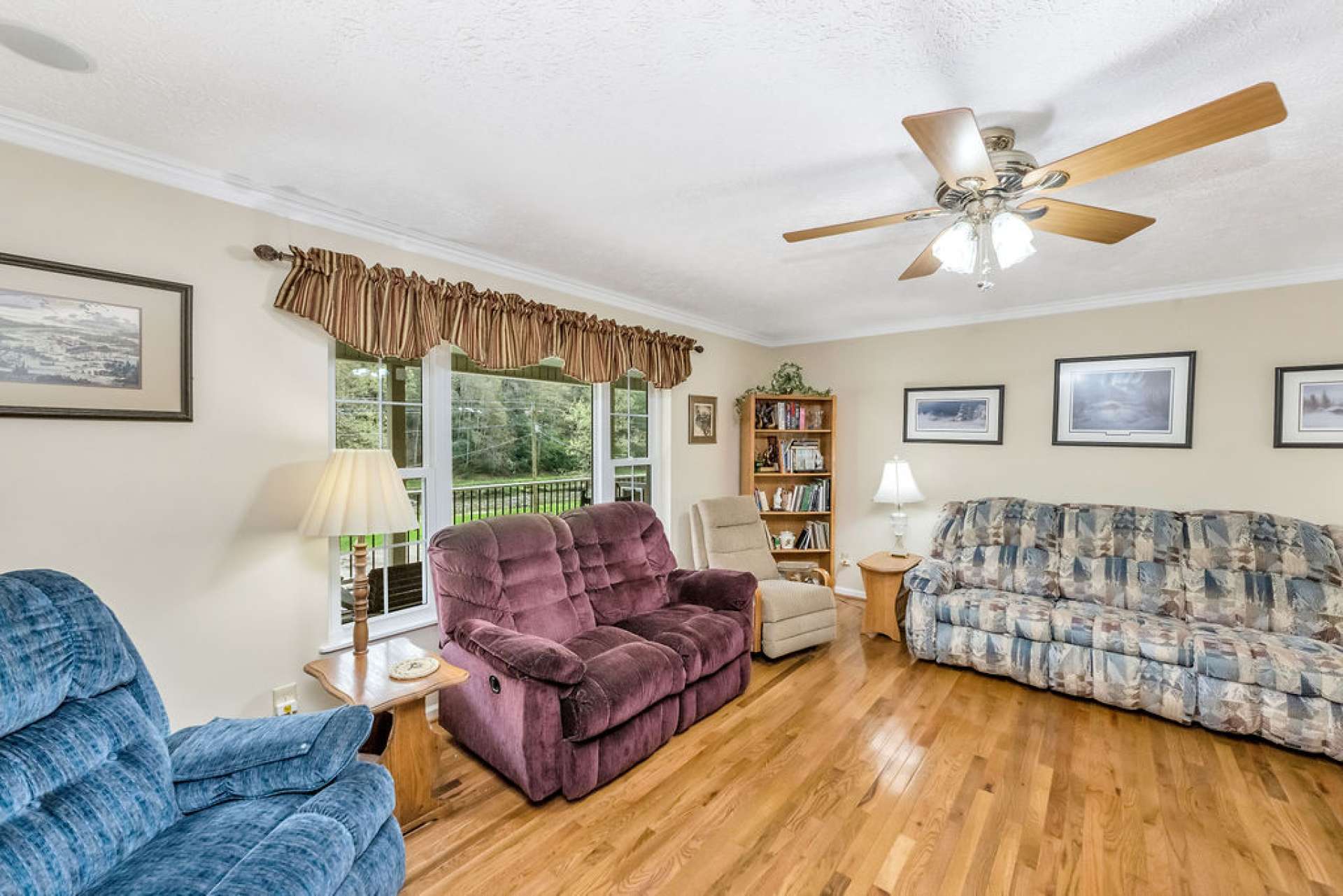 The living room features river views through the picture window.
