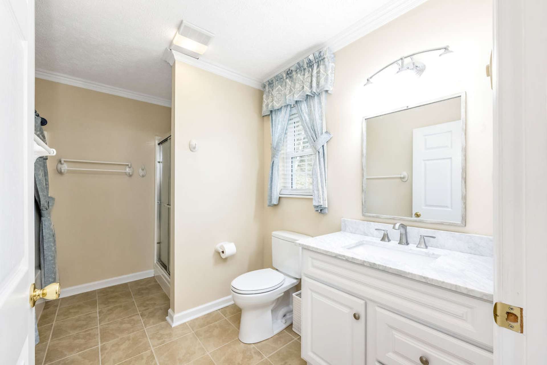 With both a step-in shower and a tub/shower combo, this home offers thoughtful options for relaxation and ease.