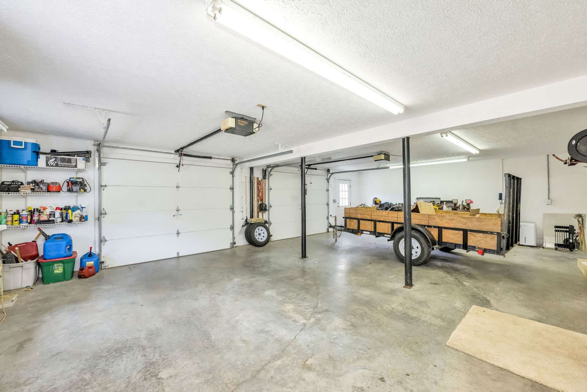 A spacious two-car garage provides ample storage for outdoor gear, kayaks, and more.