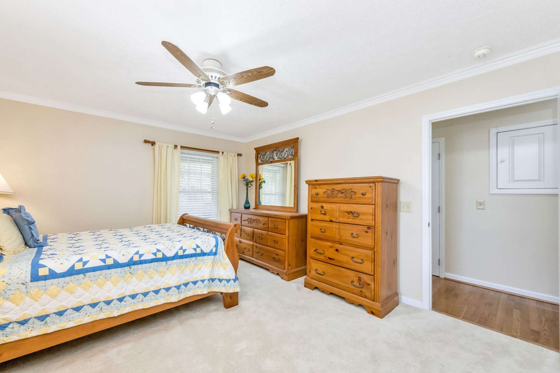 This primary features an ensuite full bath and a walk-in closet.