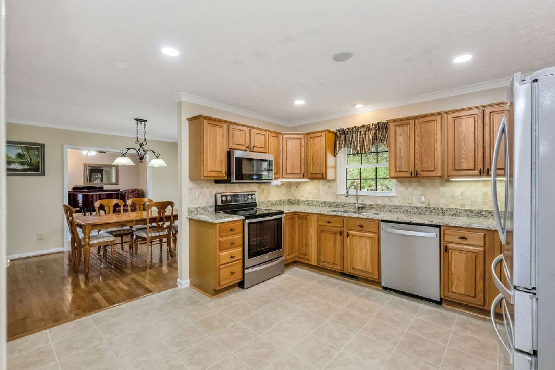 The main level showcases a beautifully updated kitchen, thoughtfully designed for both everyday living and entertaining.