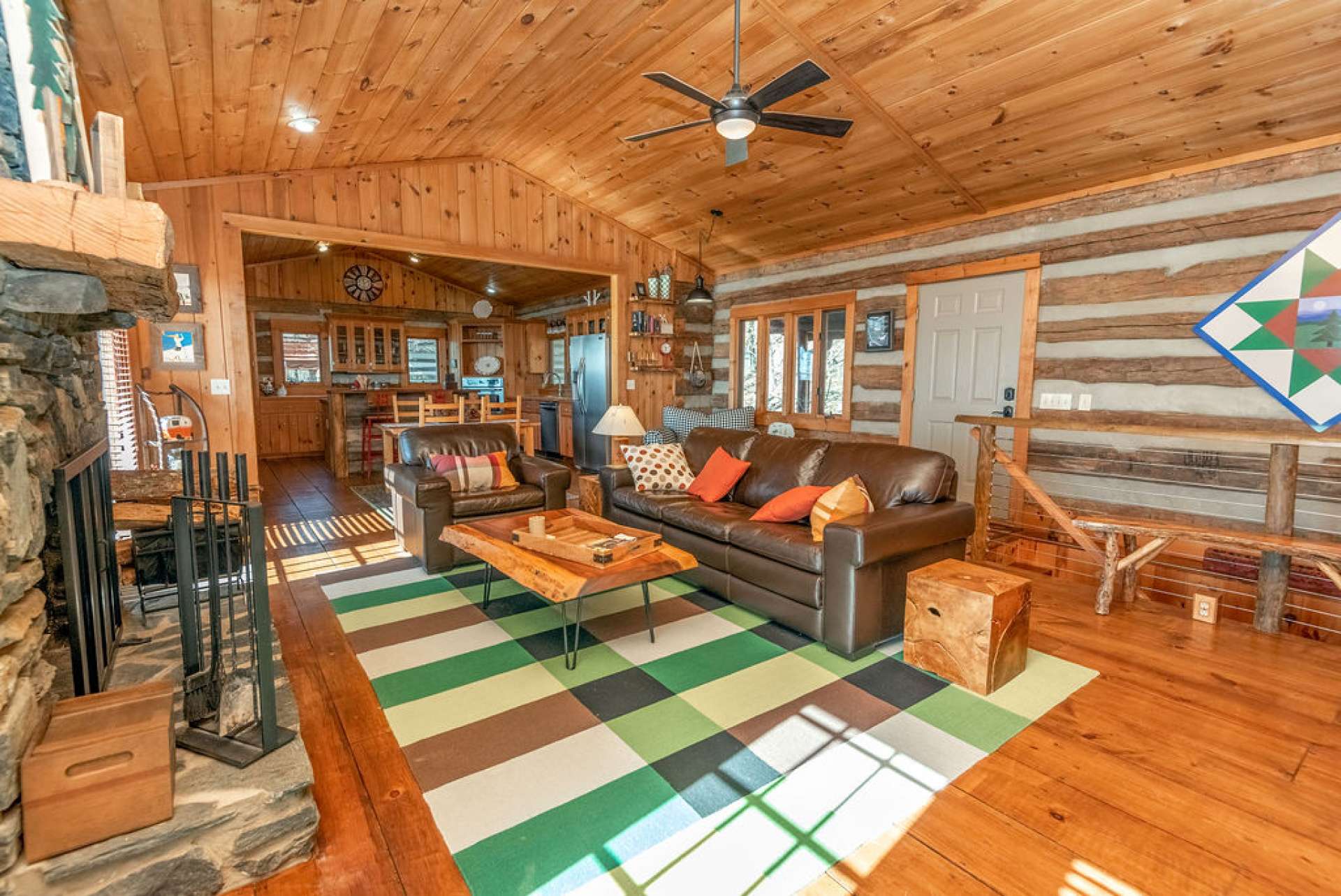 The wall between kitchen and living area was opened up to give this cabin an easy flow floor plan allowing everyone to gather together.