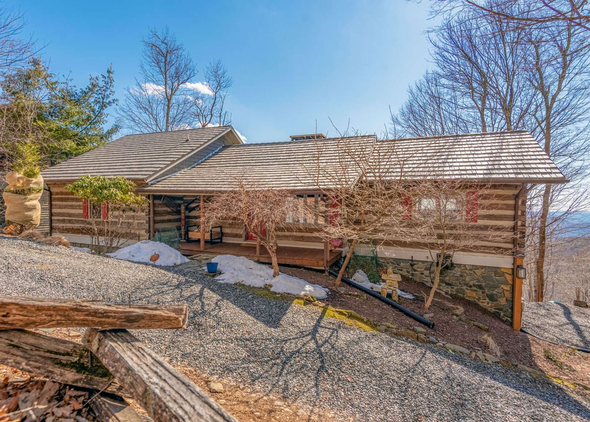 This antique style log home is in the enchanting Stonebridge community and conveniently located between Boone and West Jefferson.
