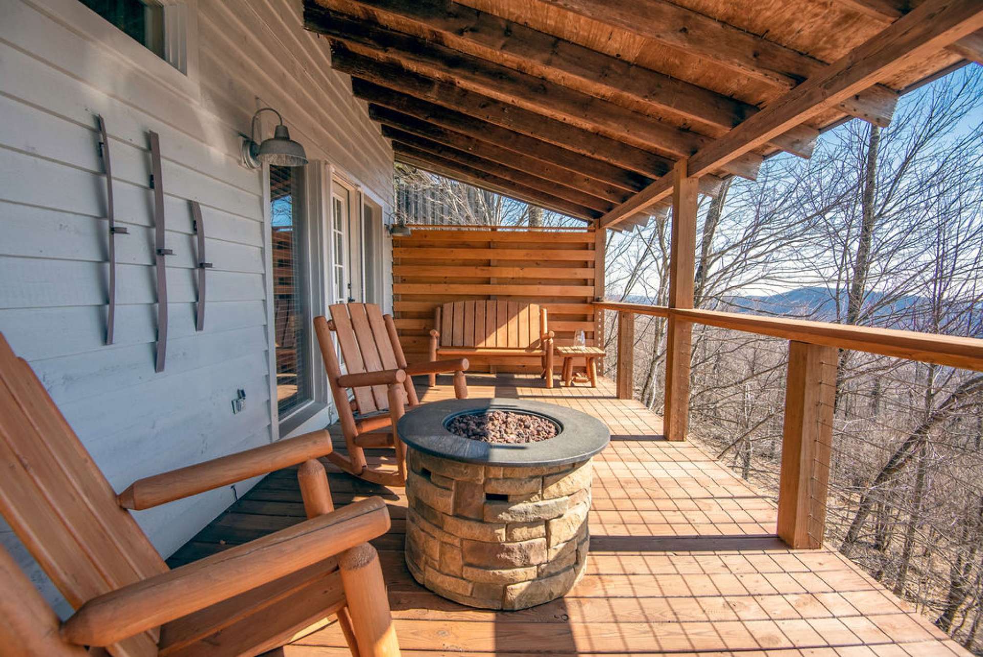 Covered deck with cozy firepit off the master.