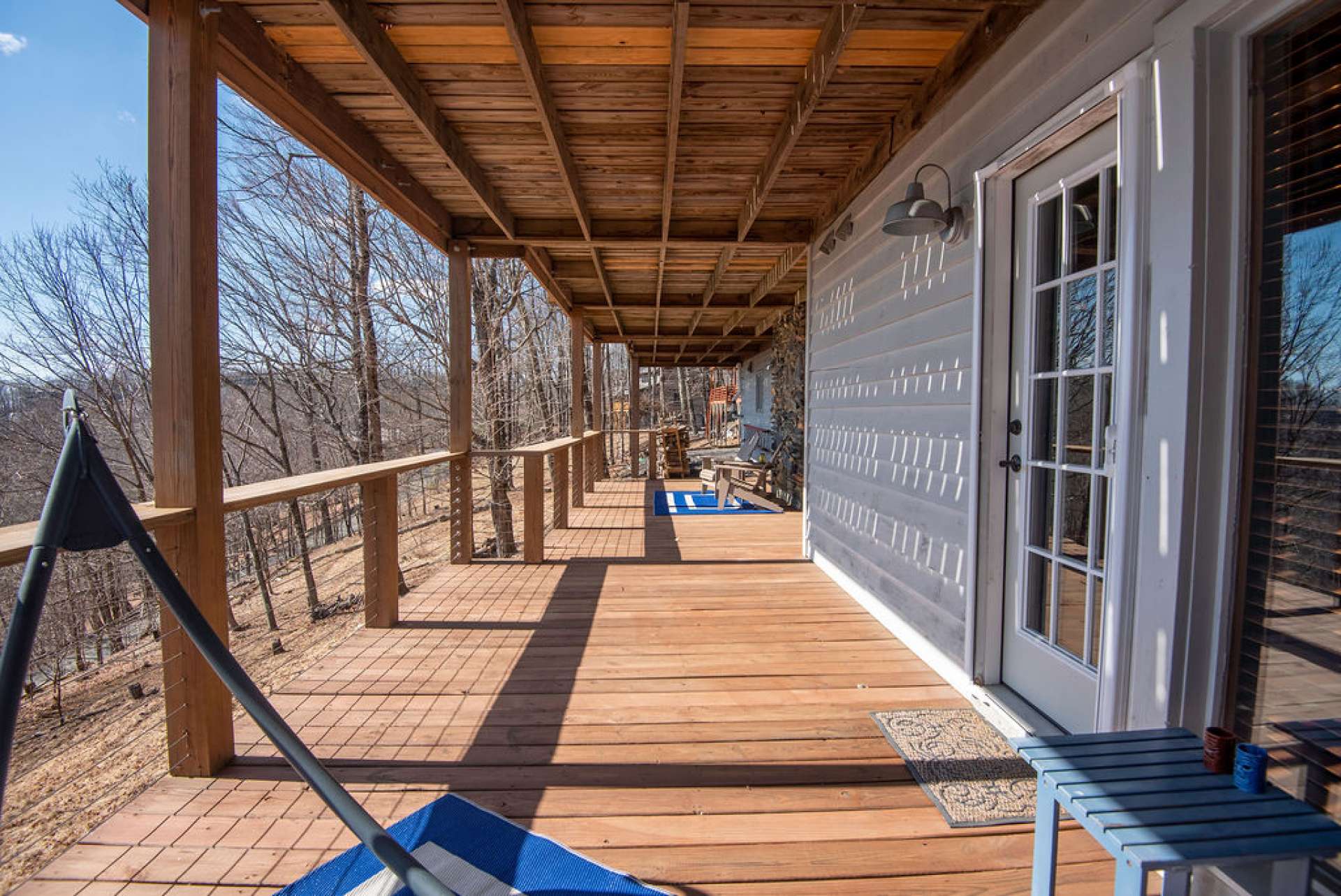 Lower level covered deck is perfect for relaxing, reading or an afternoon siesta.
