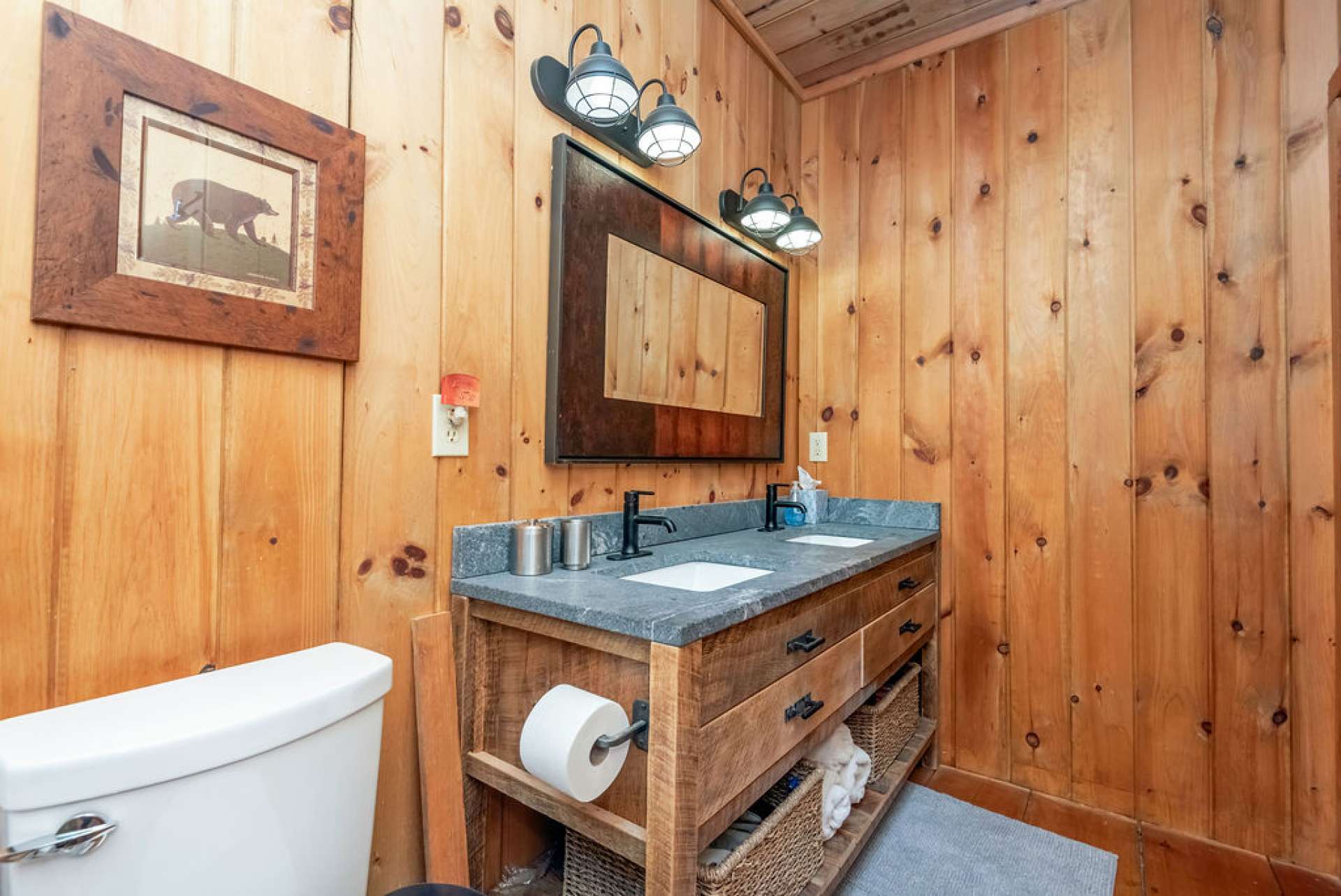 Double sinks with barn wood vanity in master bath. Shower is currently being updated with custom tile.