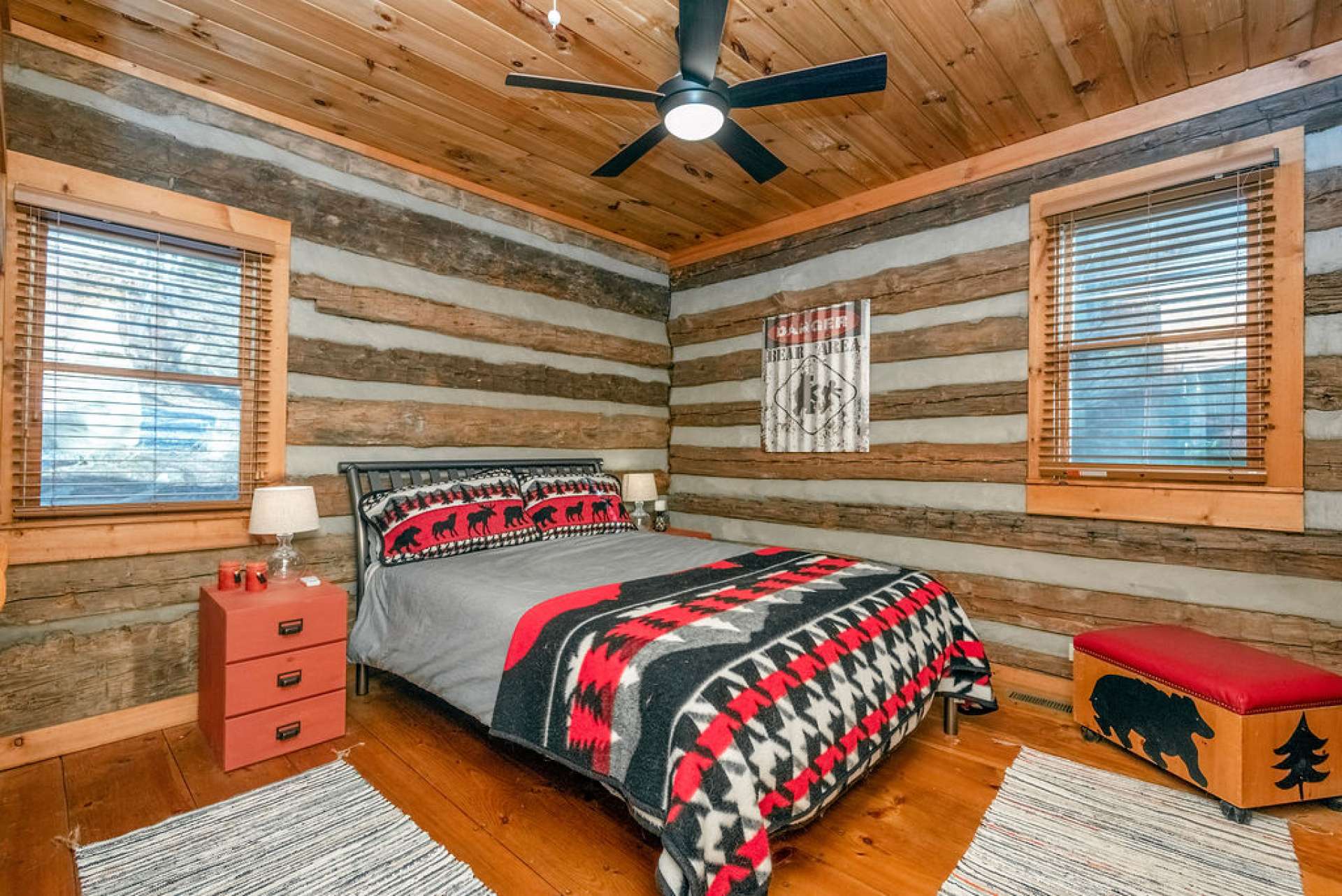 Spacious main level guest bedroom with double windows to bring in the natural light.