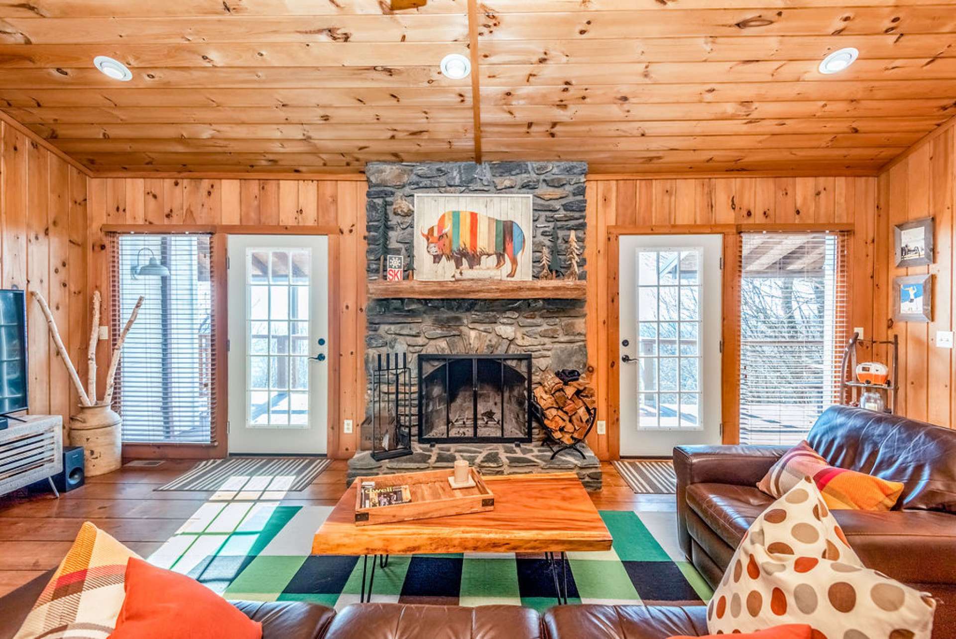 Enter through the front door to find this wood-burning stone fireplace centered between two sets of doors and windows, allowing abundant light and views to the beautiful mountains just steps away. Fireplace was built using native stones that were gathered directly from the community.