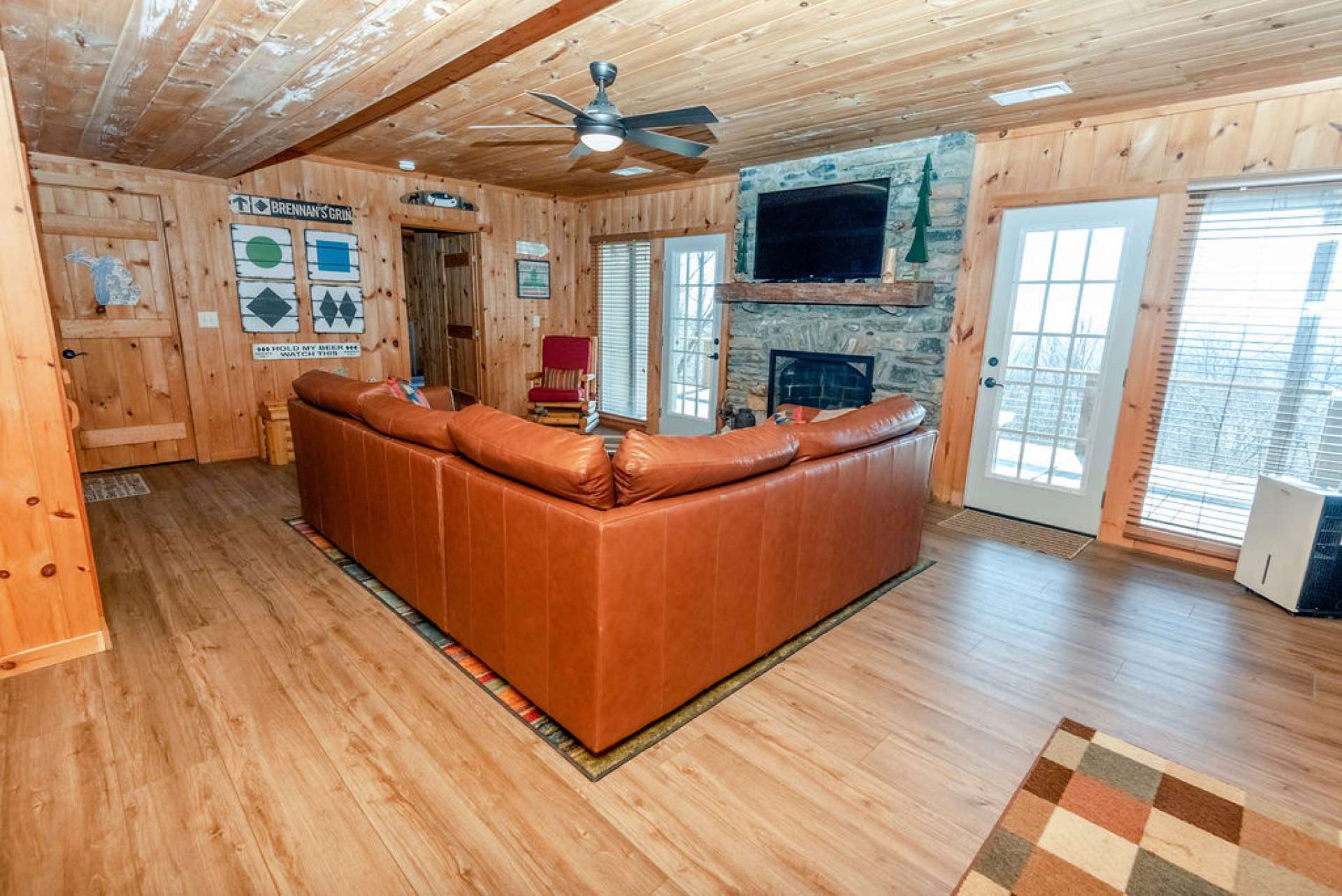 The stone fireplace on the lower level is equipped with gas logs.