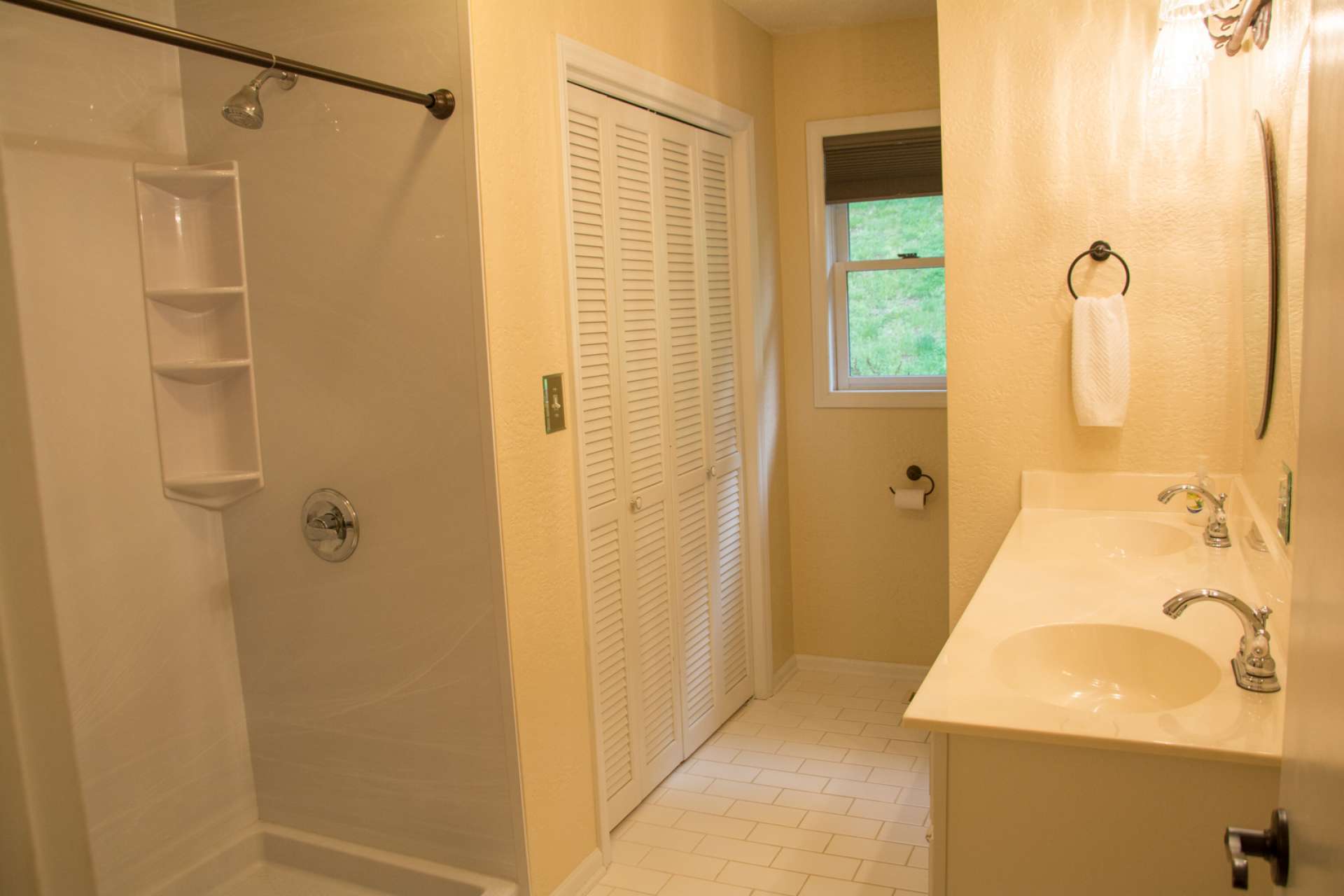 The main level bath offers a double vanity and walk-in shower.