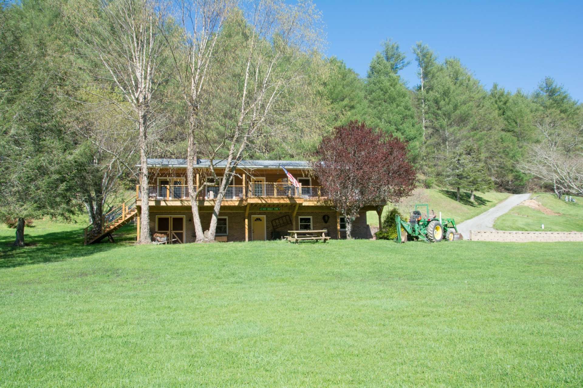 <b>Offered mostly furnished at $330,000, this cozy mountain home located on the banks of the New River in a private gated community in Piney Creek area of the Blue Ridge Mountains is ideal for your summer mountain retreat, vacation home with vacation rental history, or your primary residence.  Call us today for your private showing of this charming NC riverfront home.  Ask for information on Listing number P106</b>
