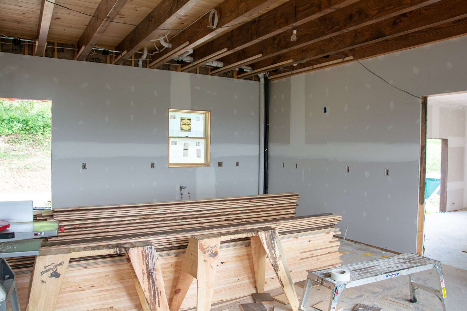 The modern kitchen will feature granite counter tops, large island with bar seating, gas range and apron sink.