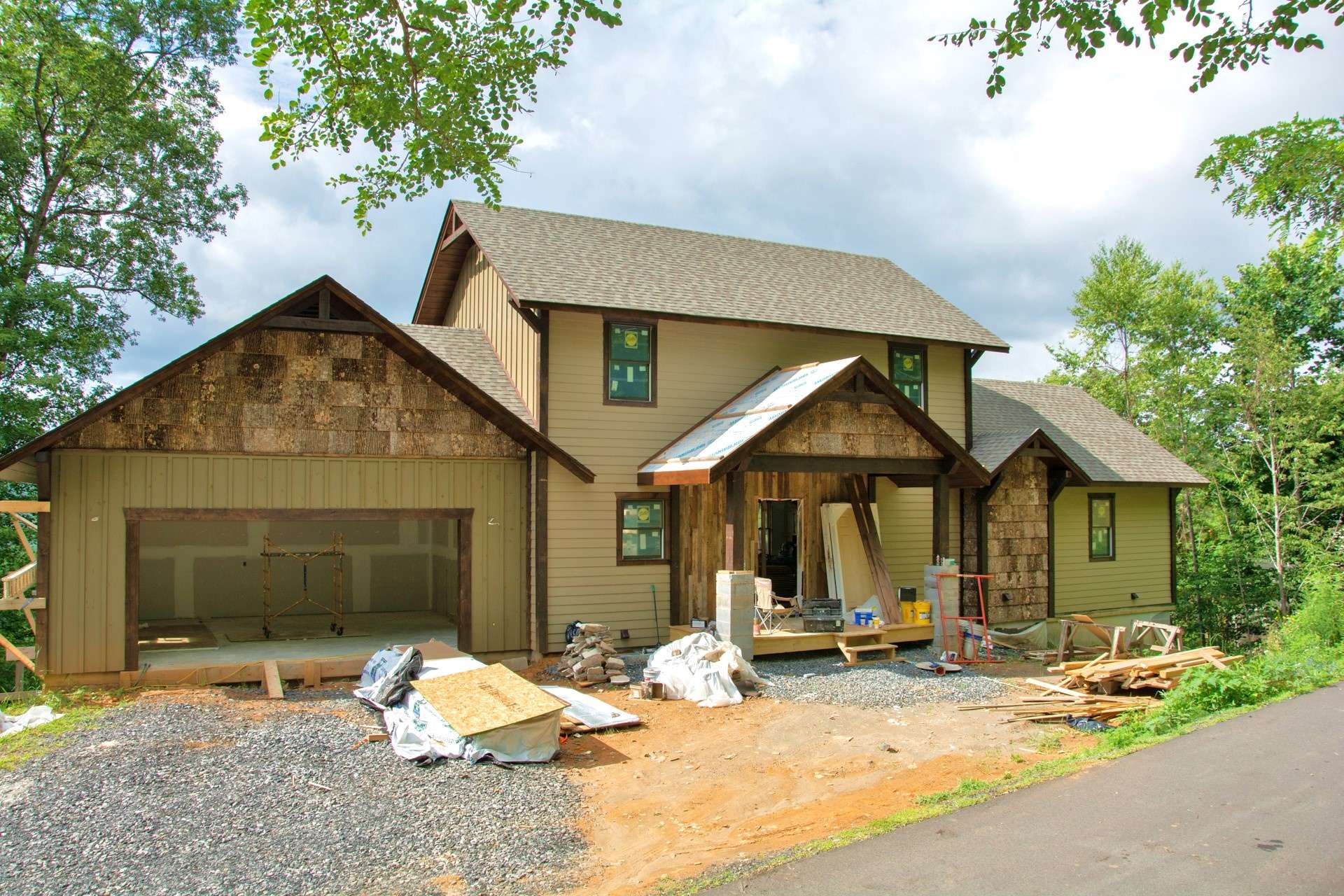 Elk Ridge is a gated community, with paved streets and underground utilities, located in the Todd area of Southern Ashe County. Only a short drive into West Jefferson, Boone, or the New River. This brand new 3-bedroom, 4.5-bath Adirondack style craftsman home with many custom details is offered at $585,000. Continue to watch for updated photos as construction progresses.  H176