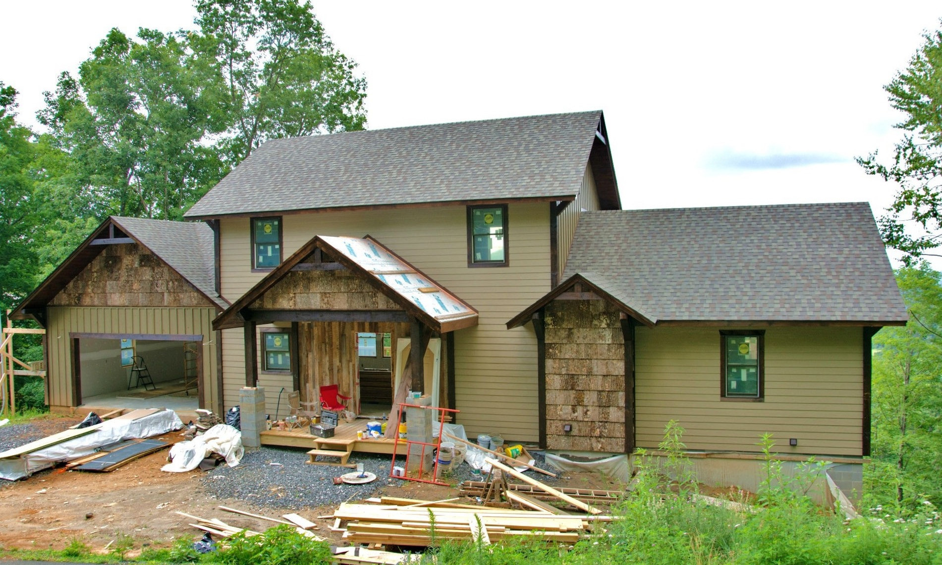 ENJOY QUALITY CRAFTSMANSHIP and magnificent long range mountain views with this new Adirondack style Blue Ridge Mountain home,under construction, in Elk Ridge, a well established community in Southern Ashe County.