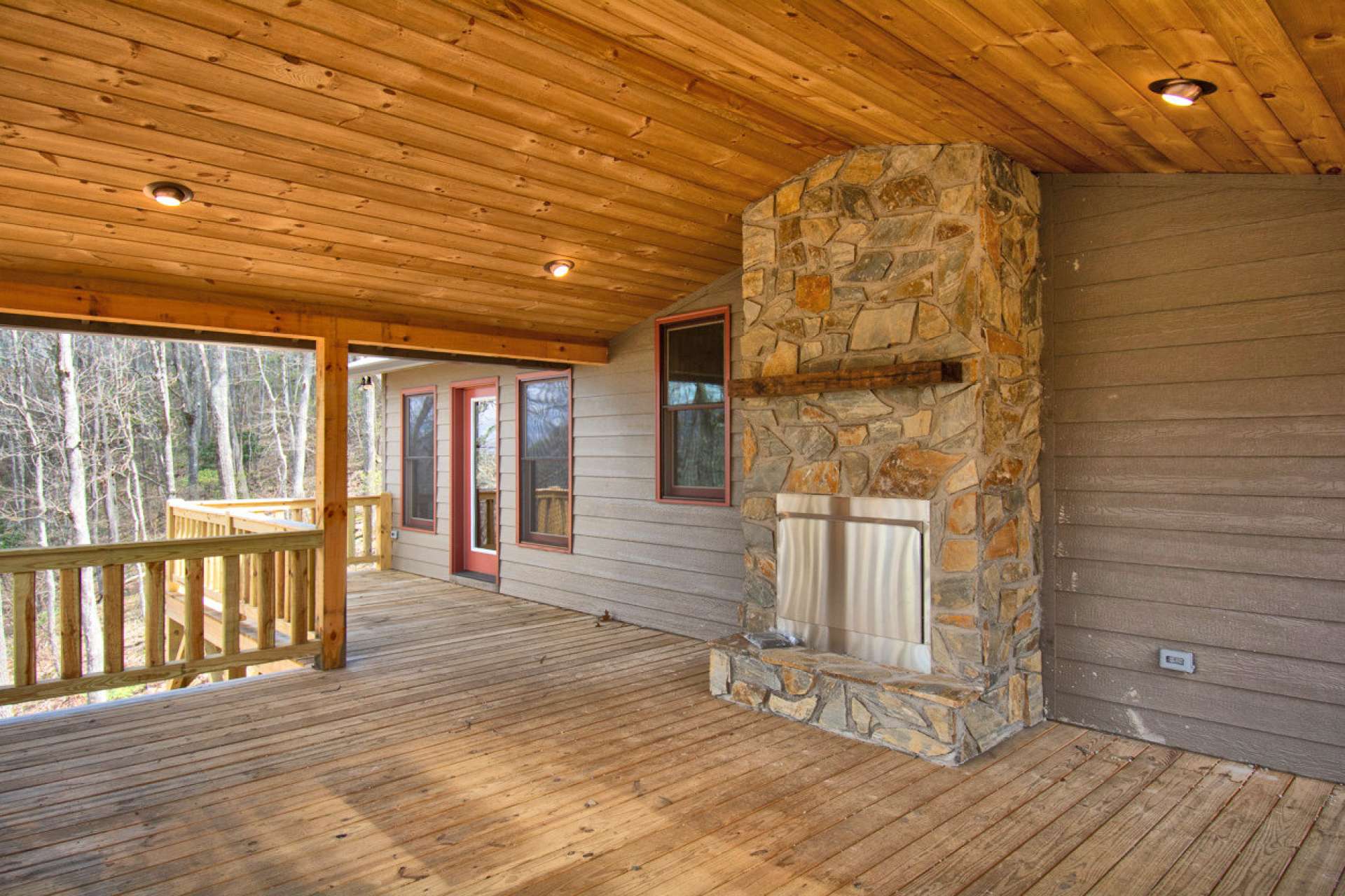 Entertain guests on the expansive covered side porch with a fireplace.