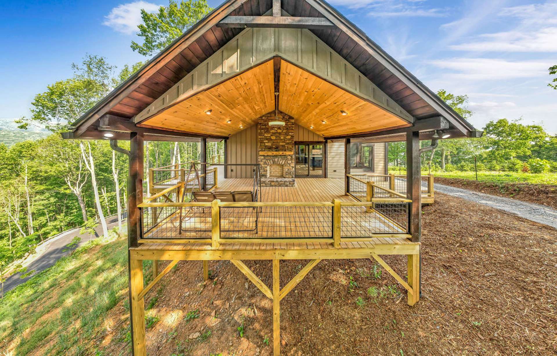 Enjoy the views and fresh mountain air from this spacious 400 sf covered deck which includes an outdoor fireplace.