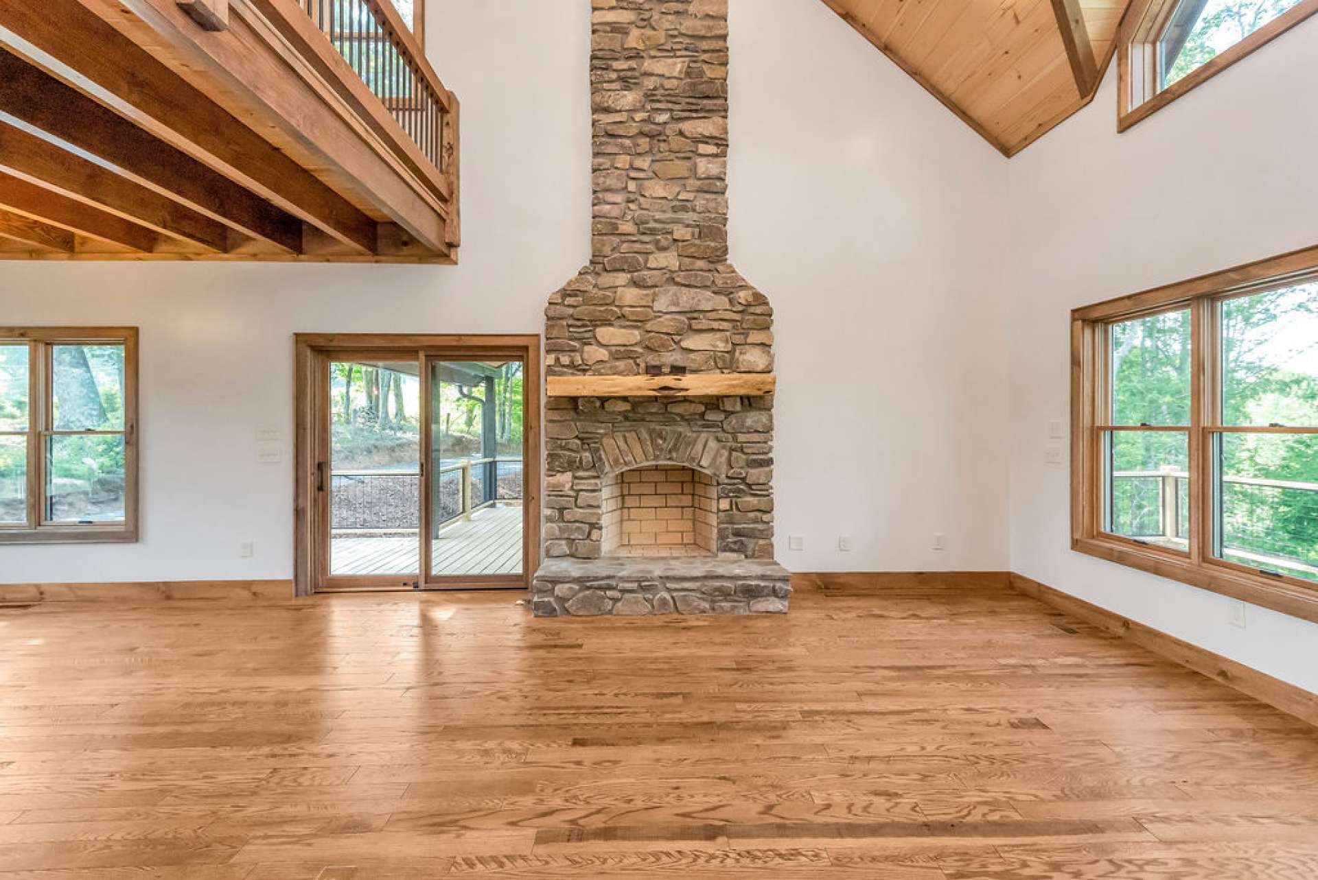 Great room also offers a stone wood-burning fireplace.