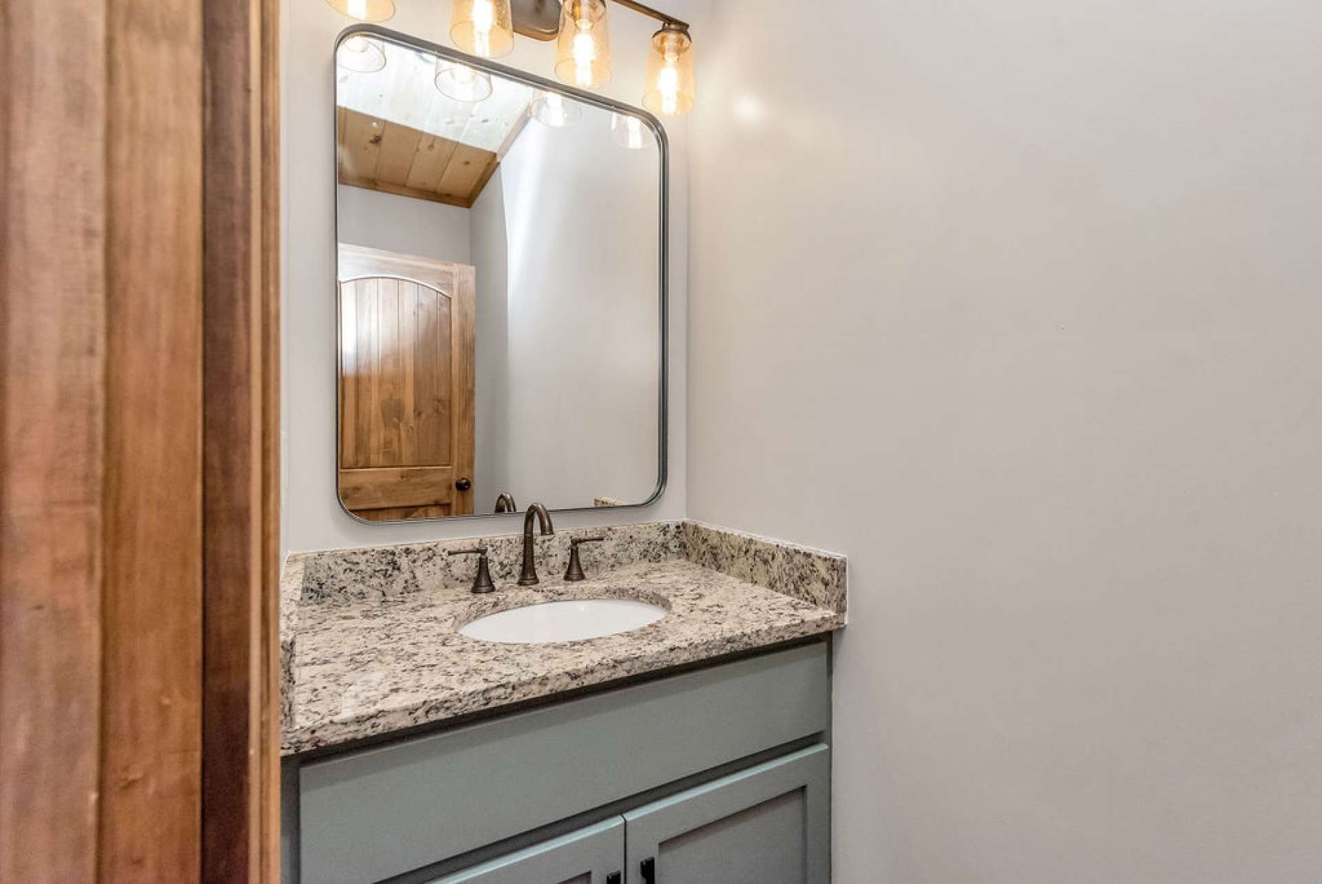 Main level also offers a powder room for your guests.